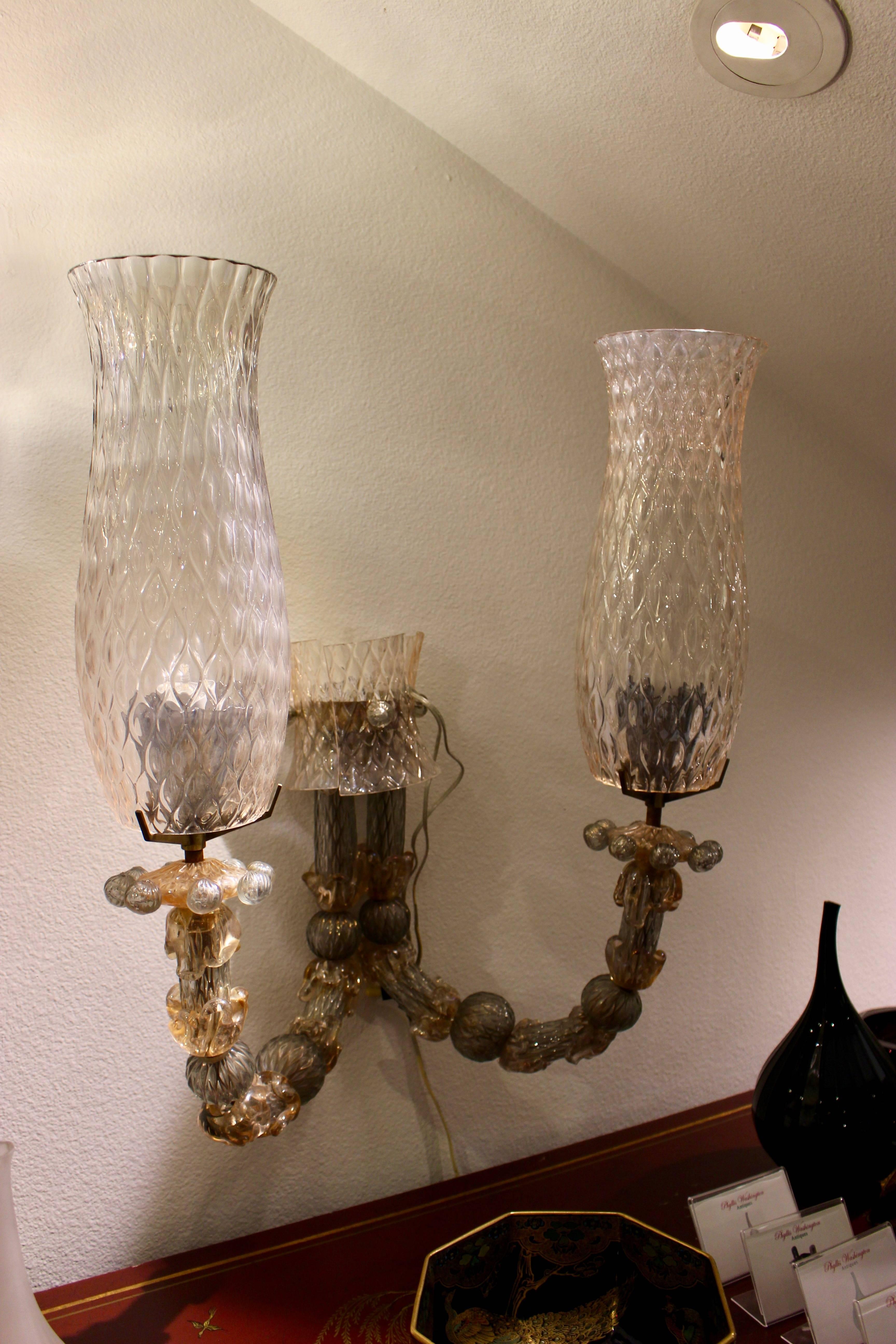 A pair of Italian mold blown glass with two-arm wall lights, circa 1940.