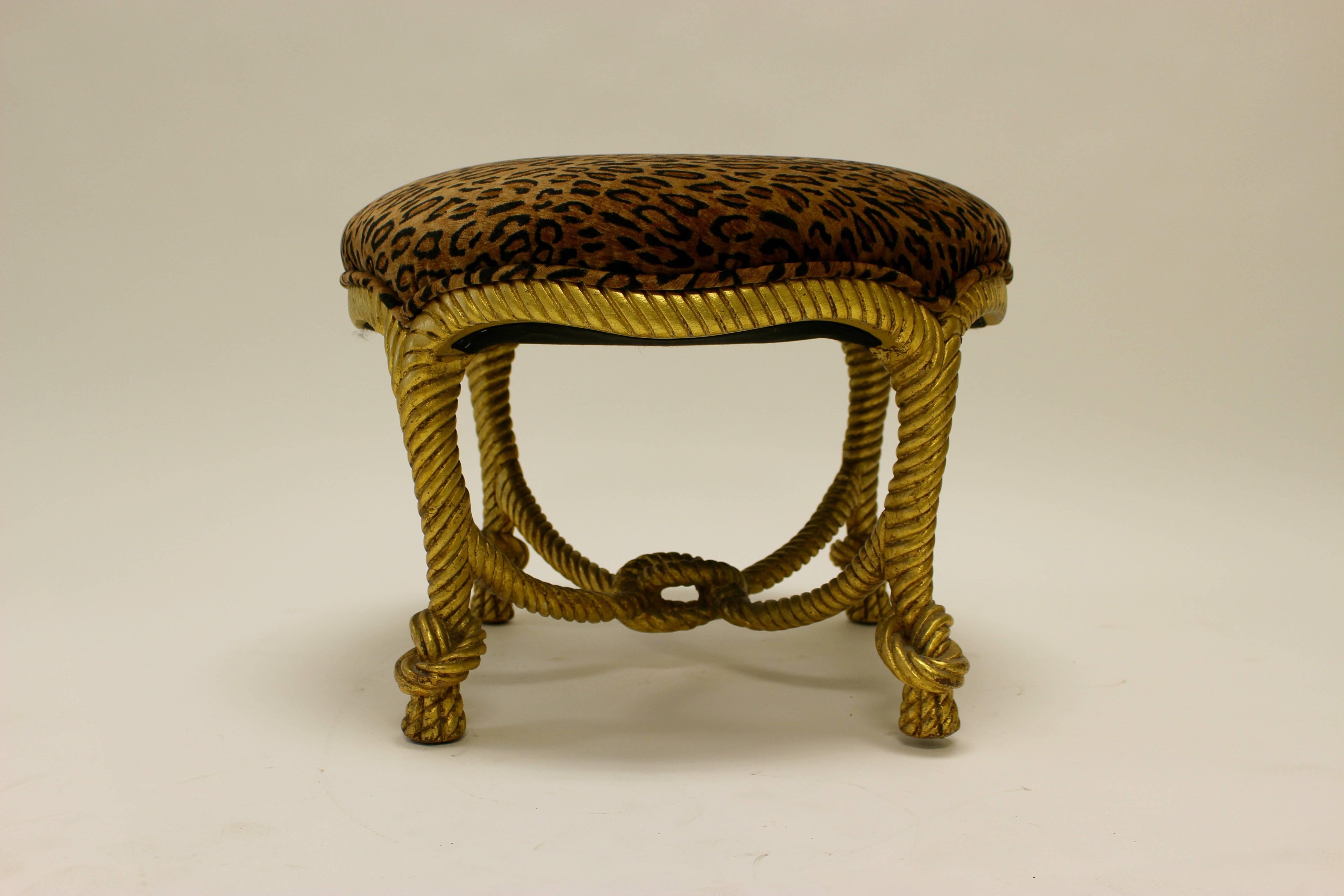 A French decorative Napoleon III style giltwood rope stool in the manner of A.M.E Fournier, with a circular seat upholstered in a modern jaguar velvet fabric. Resting on four carved twisted rope-like legs ending in tassel feet, the stool presents a