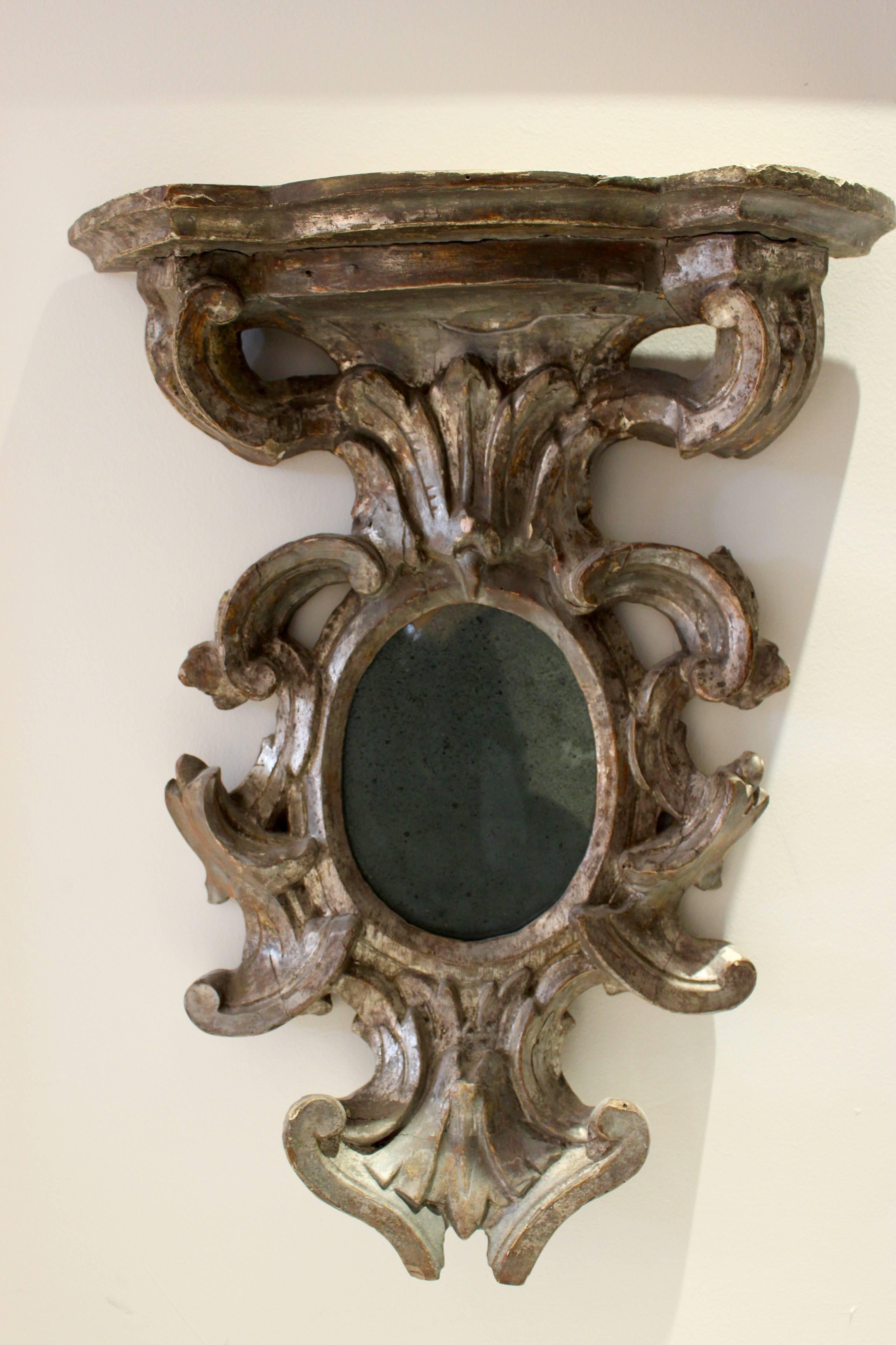 Carved Petite French Baroque Style 1885s Silvered Wood Wall Bracket with Oval Mirror For Sale
