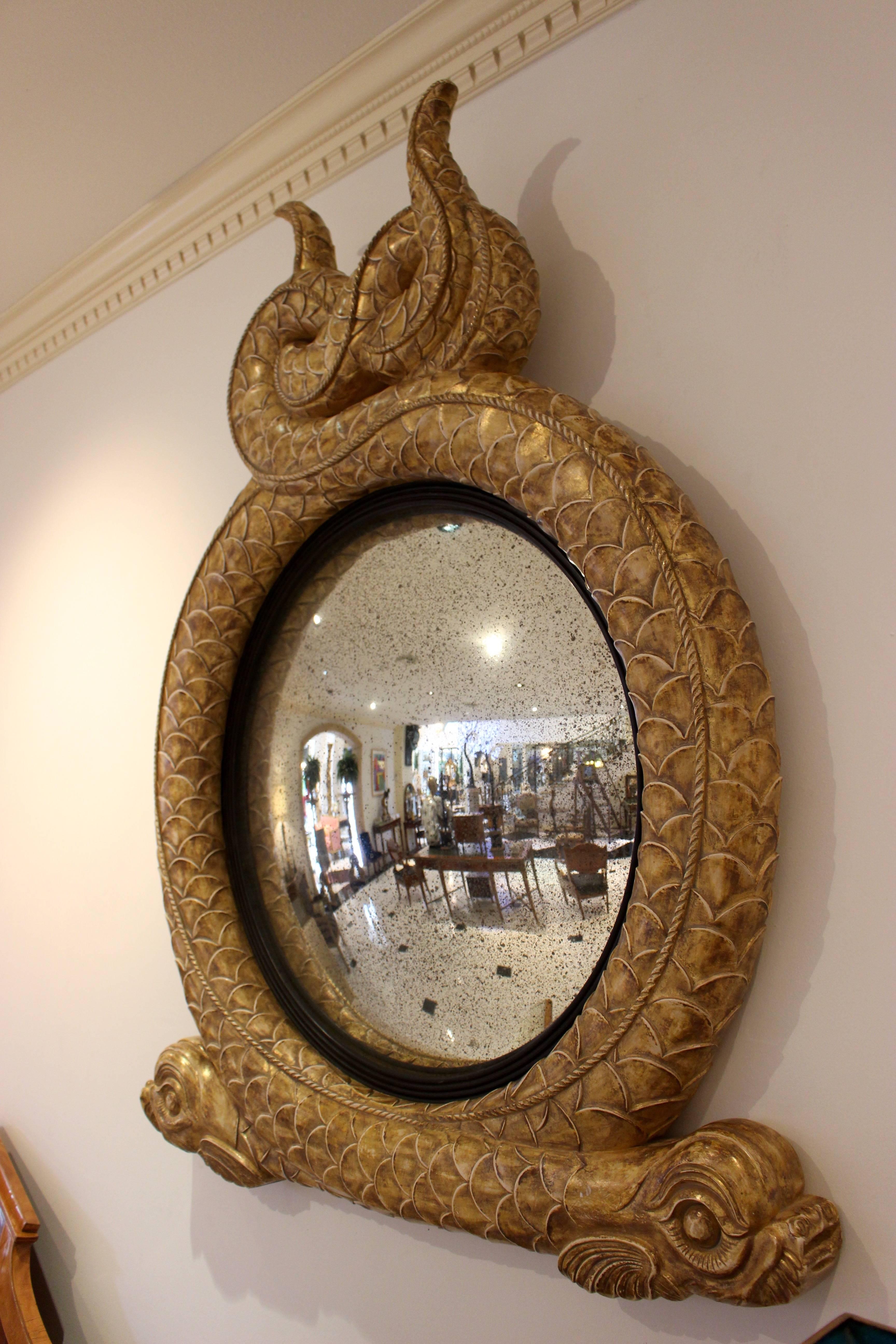 Pair of Regency Style Dolphin Giltwood and Parcel Ebonized Convex Mirrors In Good Condition For Sale In Palm Desert, CA