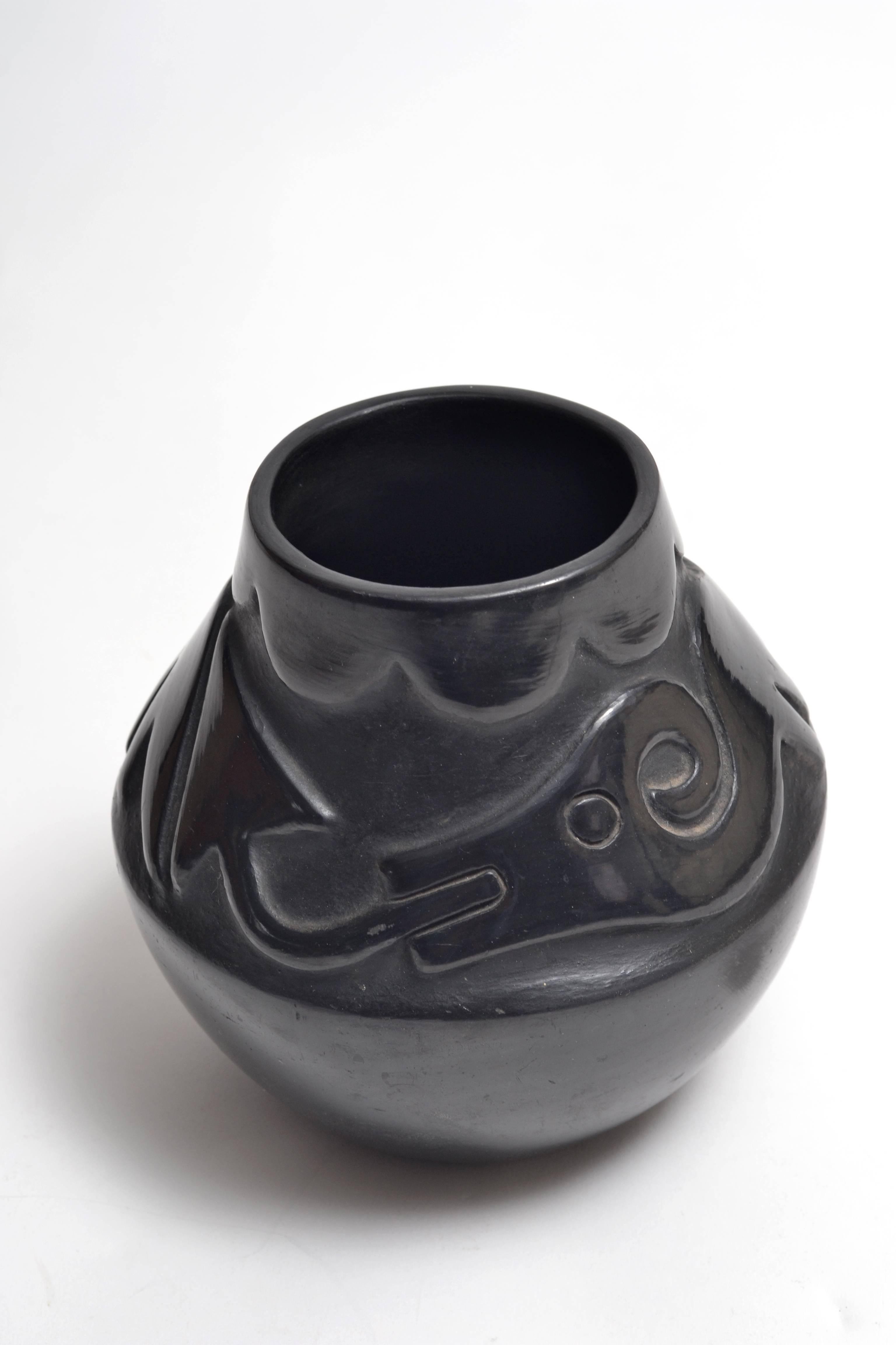 Native American Potter Rose Cata Gonzales (1900-1989) incised, black on black ceramic pot. Rose was credited as an innovator of deep carved pottery around 1930 at San Ildefonso Pueblo, NM. This work features a deeply carved 