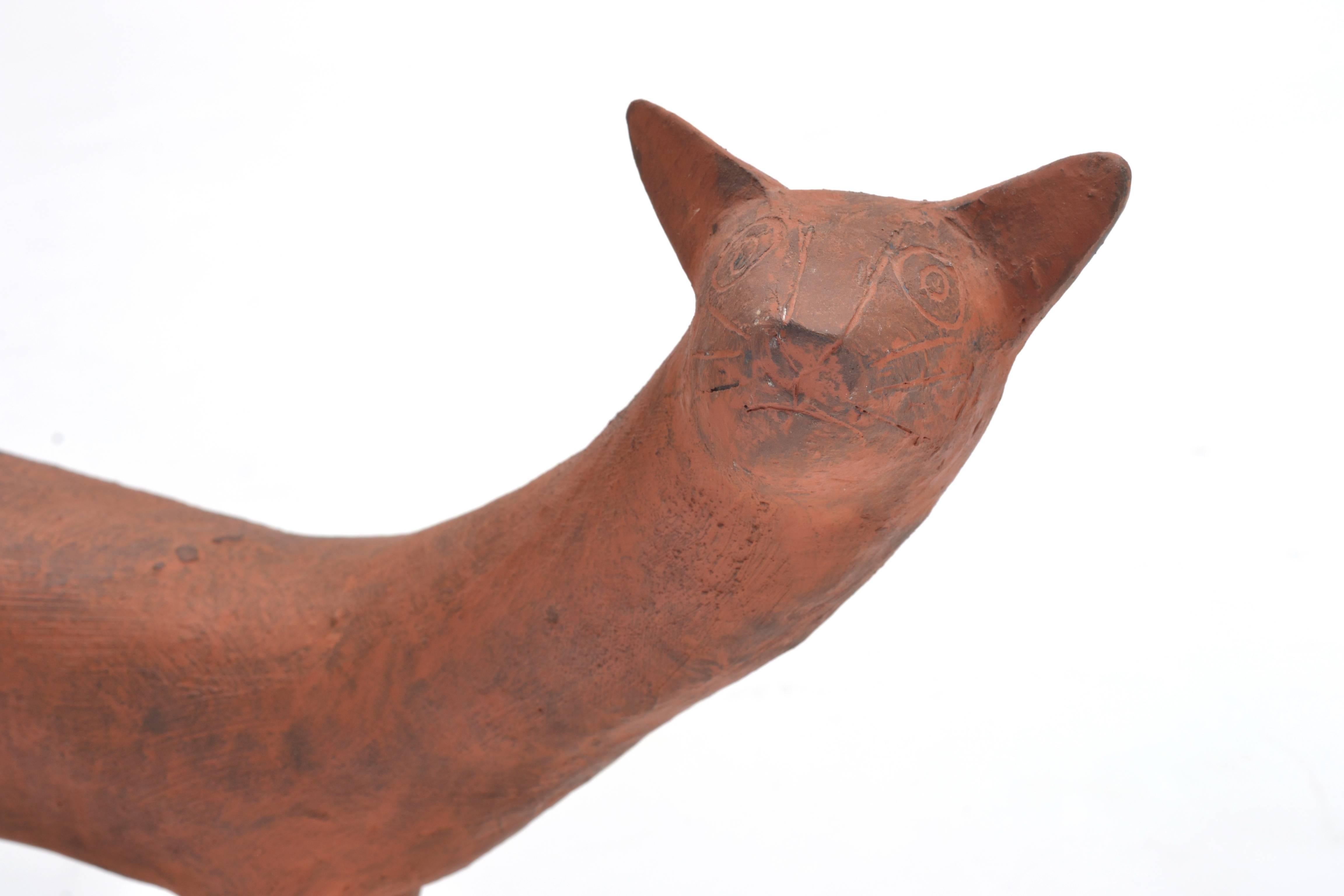 A beautiful cat sculpture by renowned American ceramist and weaver Leza McVey (1907-1984). A Cleveland native, McVey also lived and worked in Houston, Austin, San Antonio and Michigan. McVey's friends and peers included other notable ceramicists