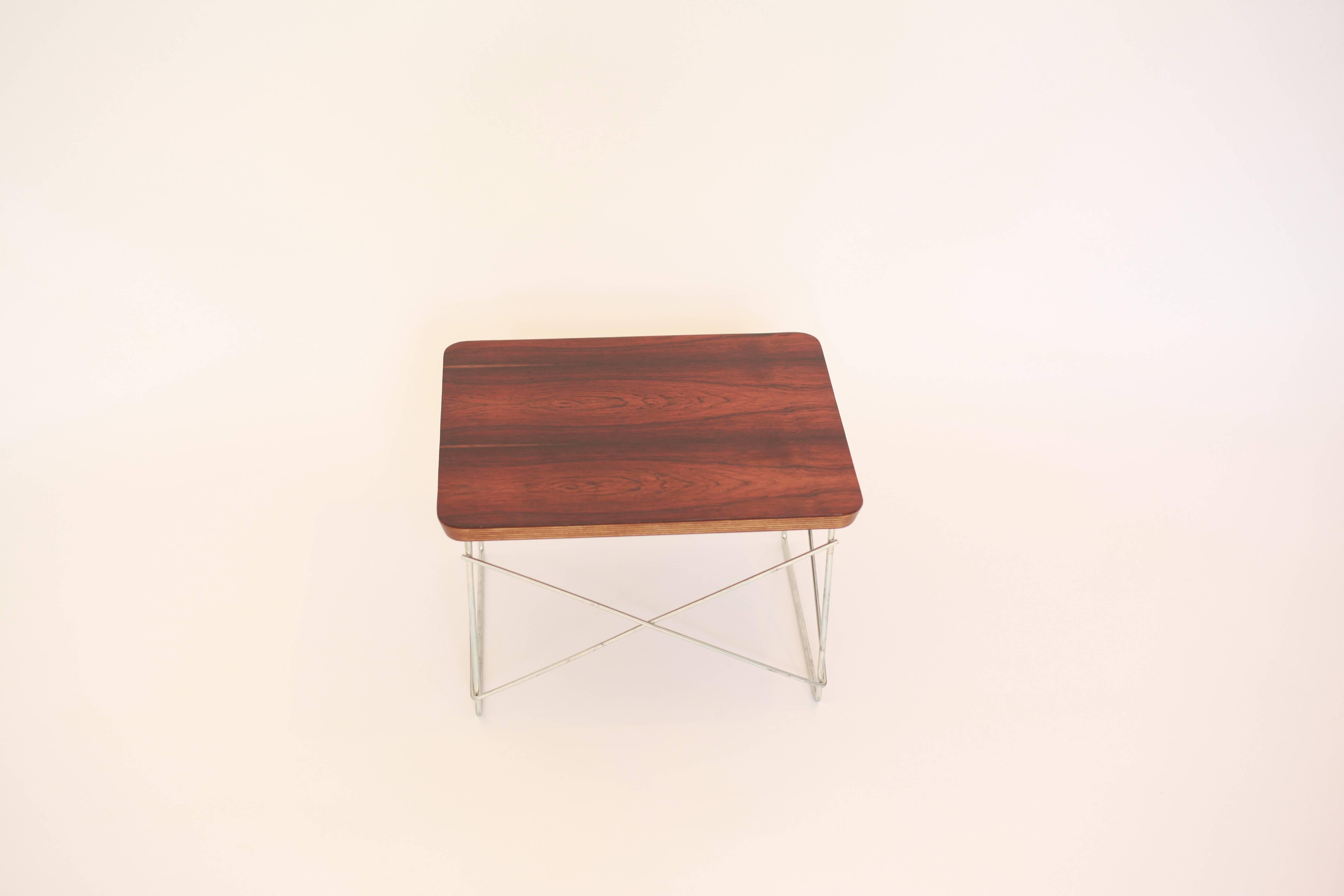 Rare Herman Miller rosewood veneer LTR. In 1996, Herman Miller released a limited edition of rosewood Eames LCW's and folding screens in an attempt use some of its stock of endangered rosewood before it reached its shelf life. A limited number of