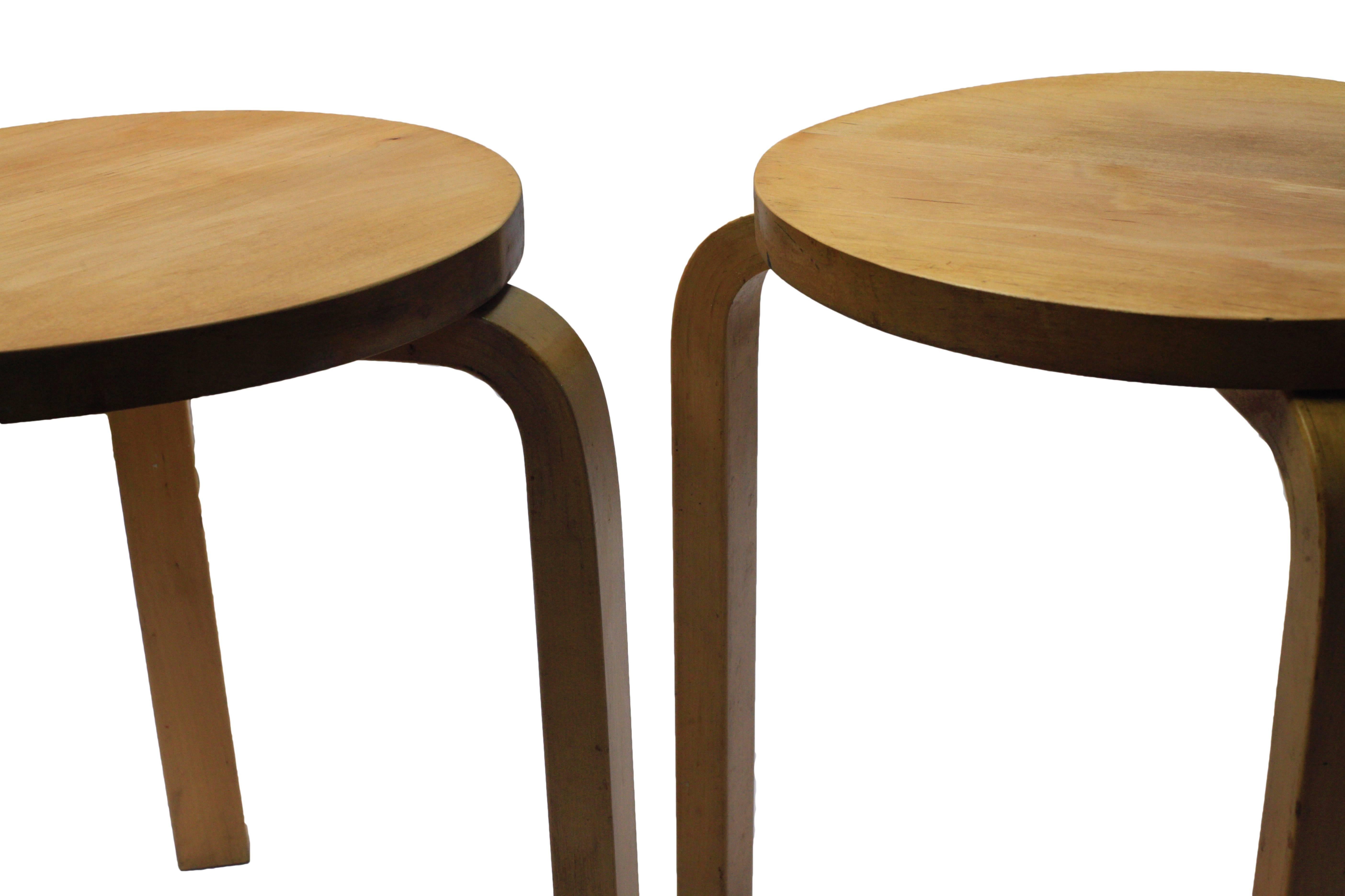 Beautiful early pair of stacking stools designed by Alvar Aalto circa 1931-1932 for Artek. Solid birch tops that were lightly refinished.