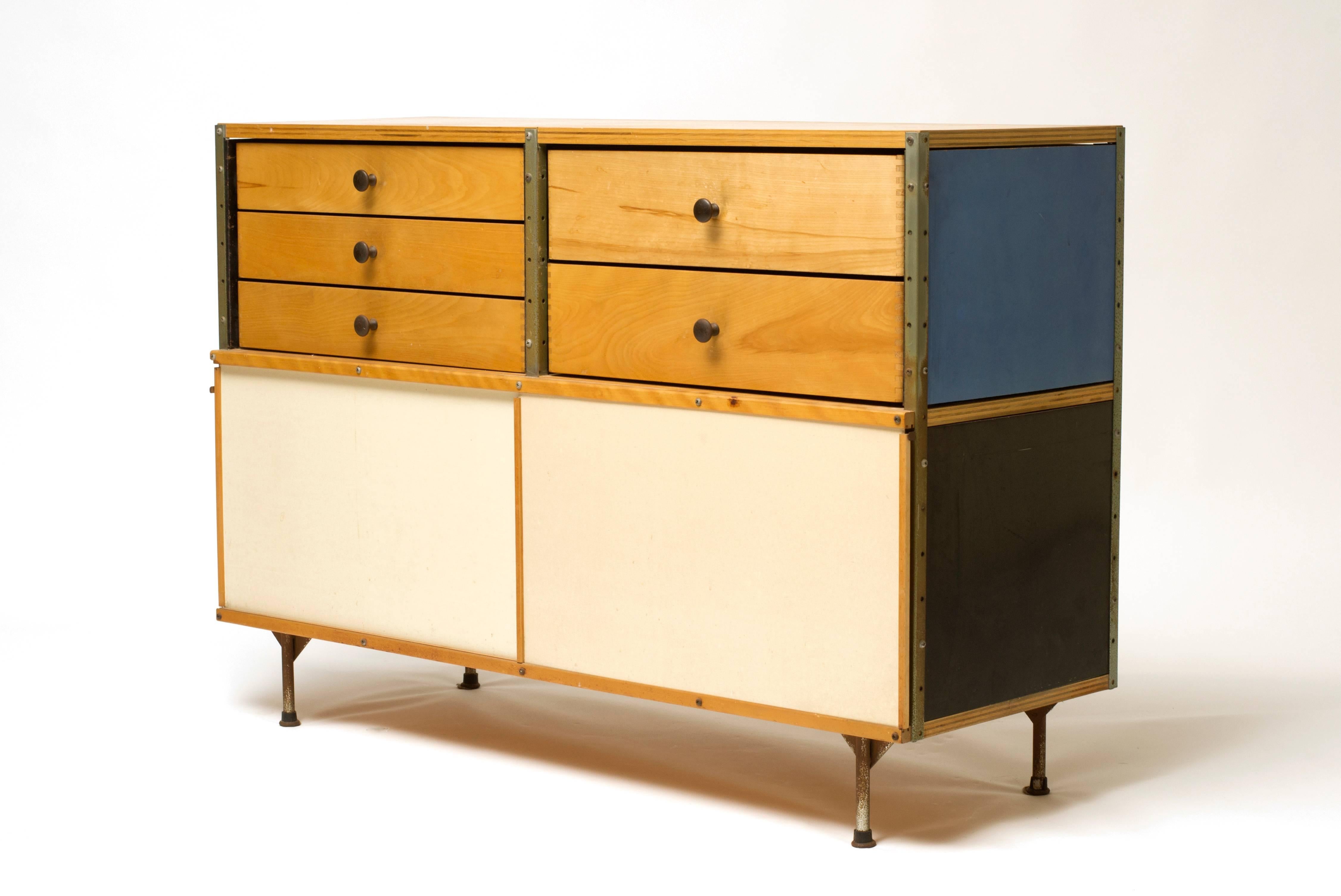 All original 1952 Eames Storage Unit featuring five drawers and two sliding doors. Side and back panels feature the sought after primary color combination of red, blue, yellow and white. The unit was acquired directly from the estate of a renowned