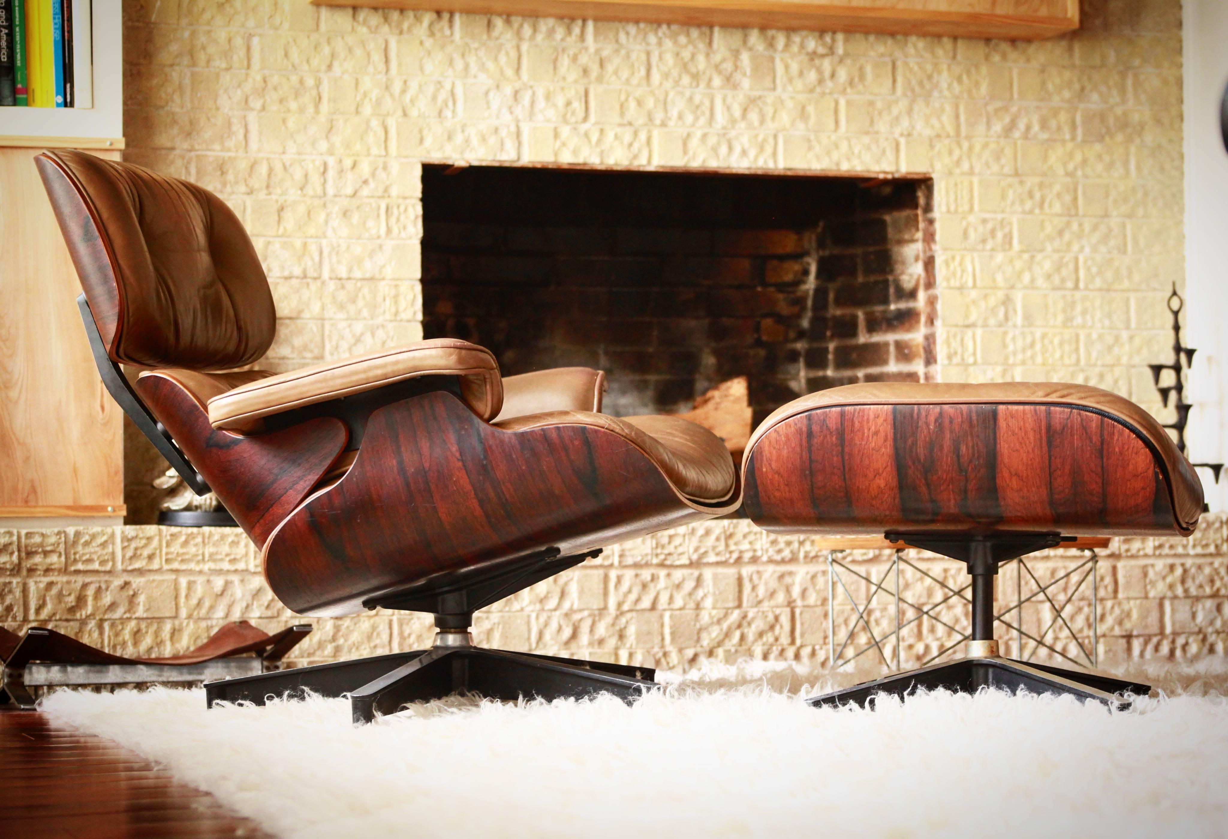 Beautiful vintage, first year production Eames lounge and ottoman. Features the round silver clips and ottoman base built for slip on boot glides (missing).