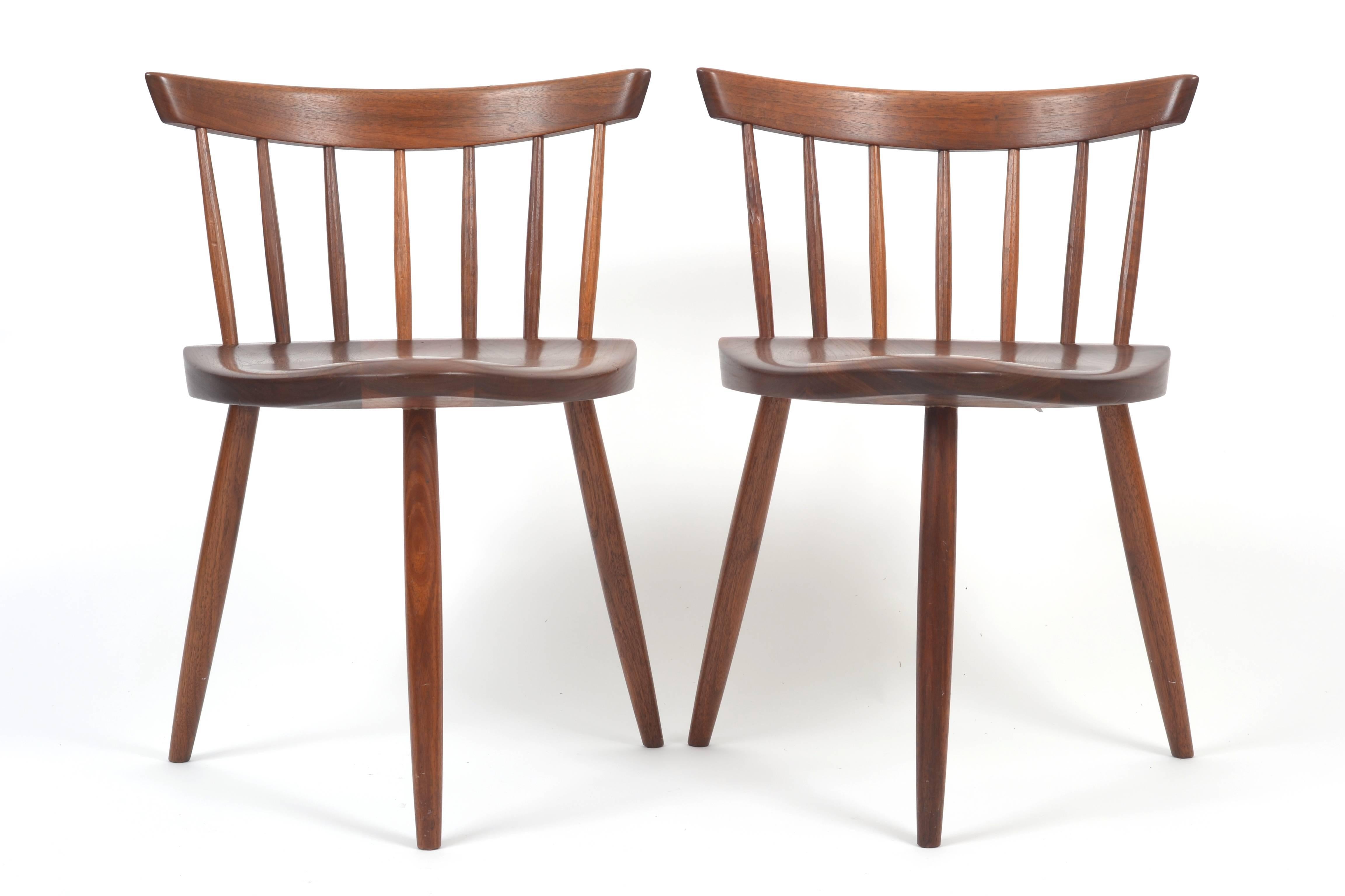 A gorgeous pair of 1967 George Nakashima "Mirra" chairs in walnut. The chairs have great provenance and previously belonged to two different prominent Texas architects.