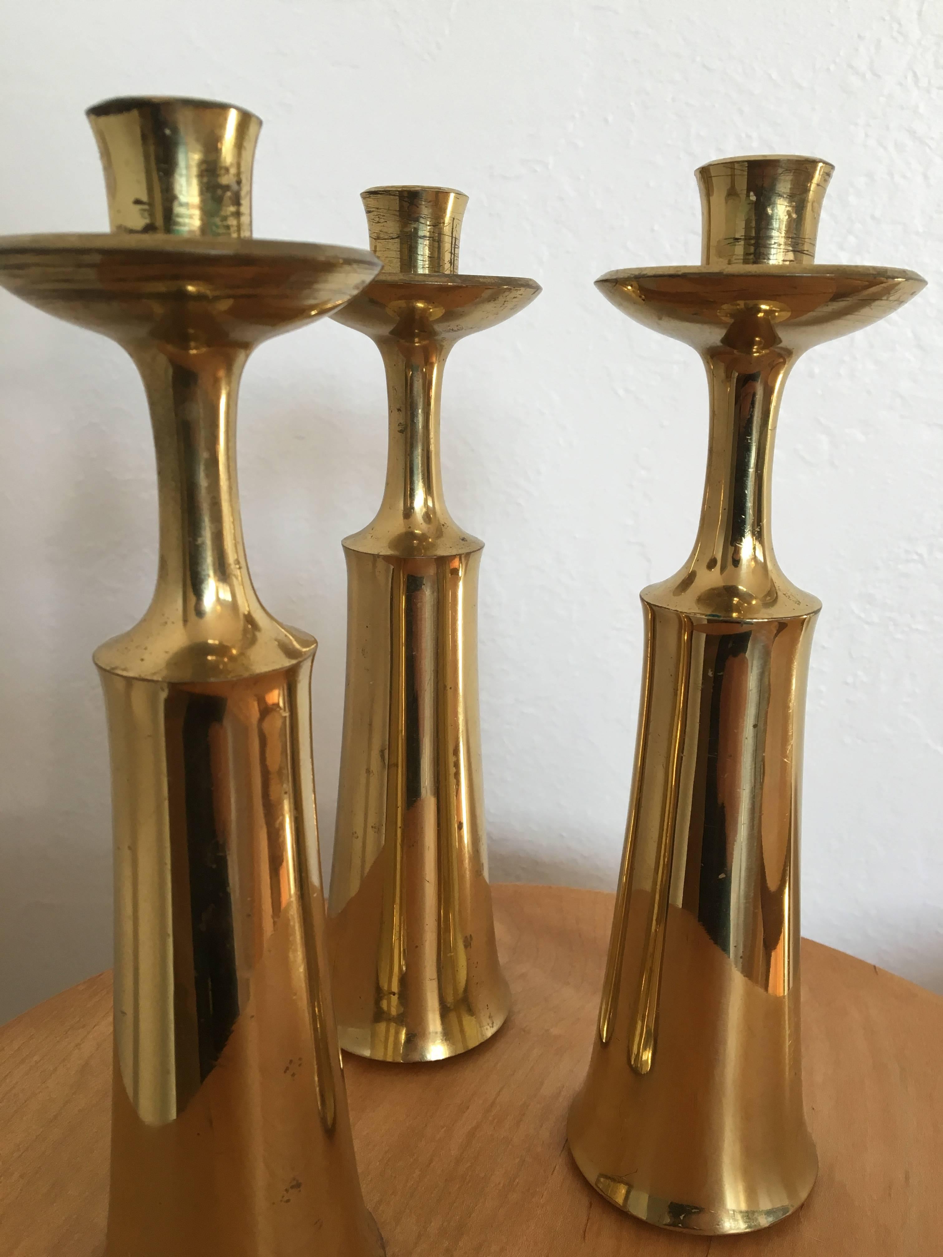 Beautiful set of three candleholders by Danish designer Jens H. Quistgaard. Marked.