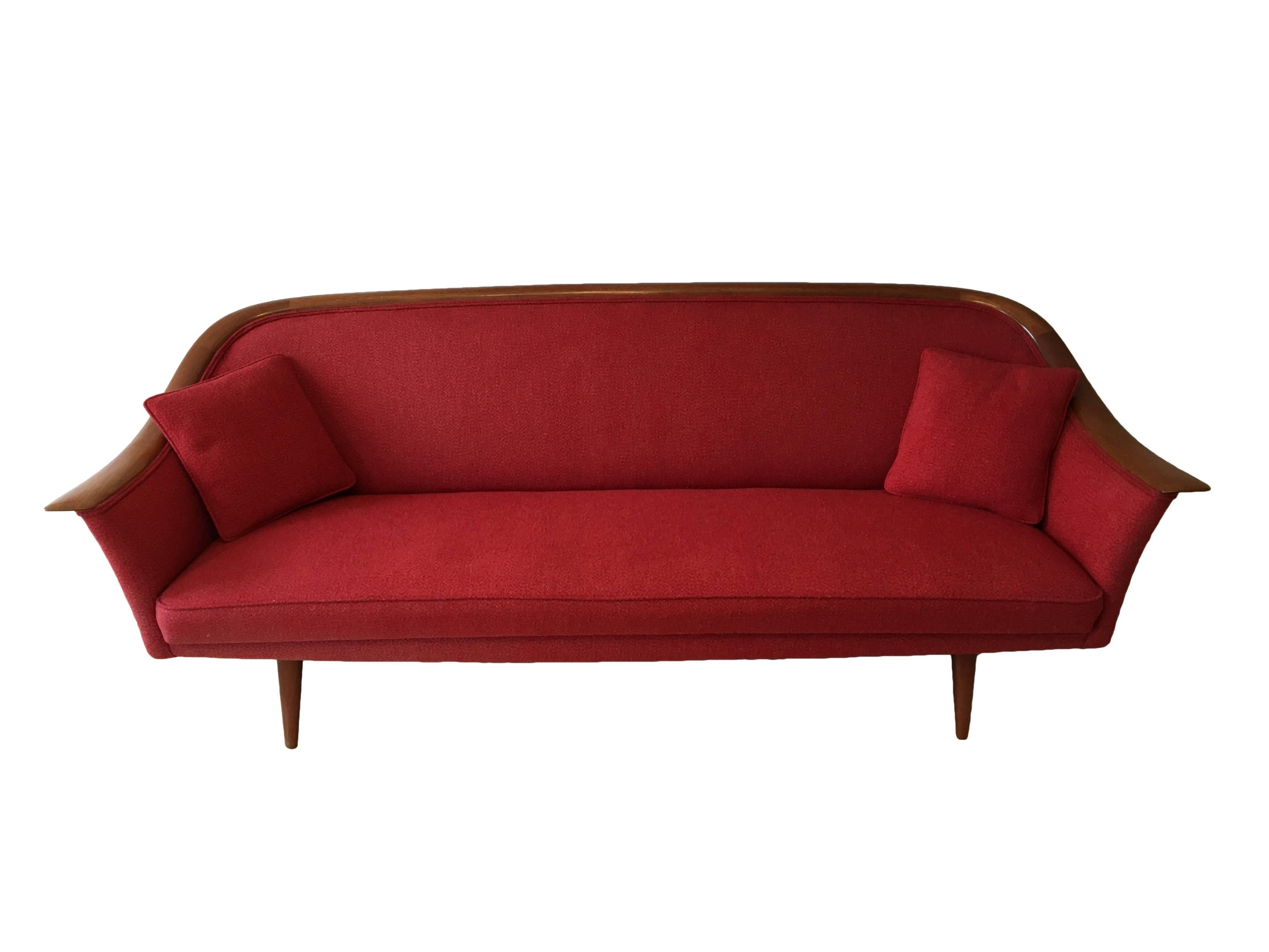 Sculptural Mid-Century sofa with teak turned legs and continuous arm and backrest. Model number 550, the first design for Vatne by Fredrik Kayser. Beautiful wool upholstery in excellent condition. Overall in excellent condition for its age.