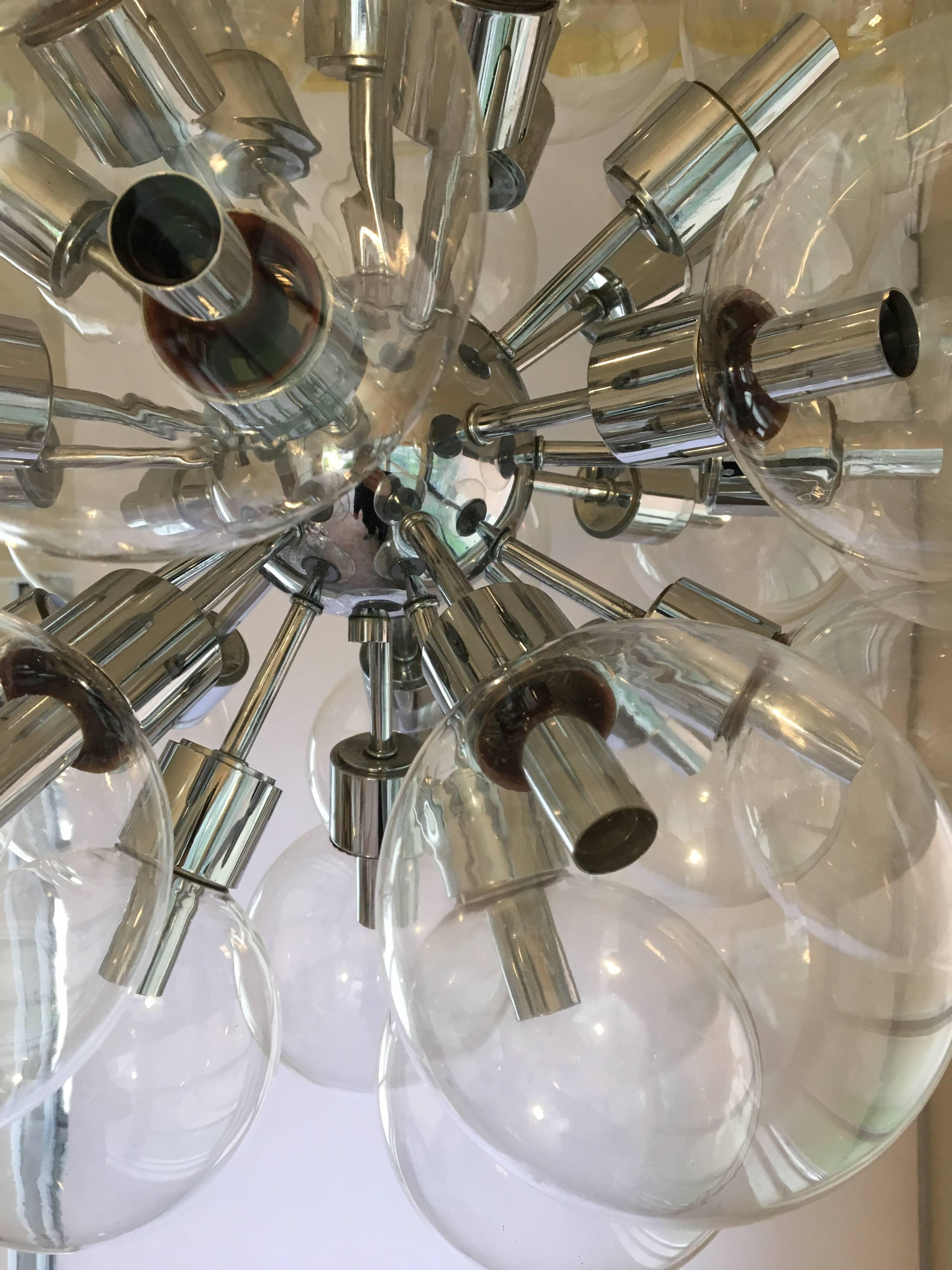 Monumental chrome chandelier designed by Motoko Ishii for Staff Leuchten, Germany, 1970s. 28 blown glass globes on a chrome frame.