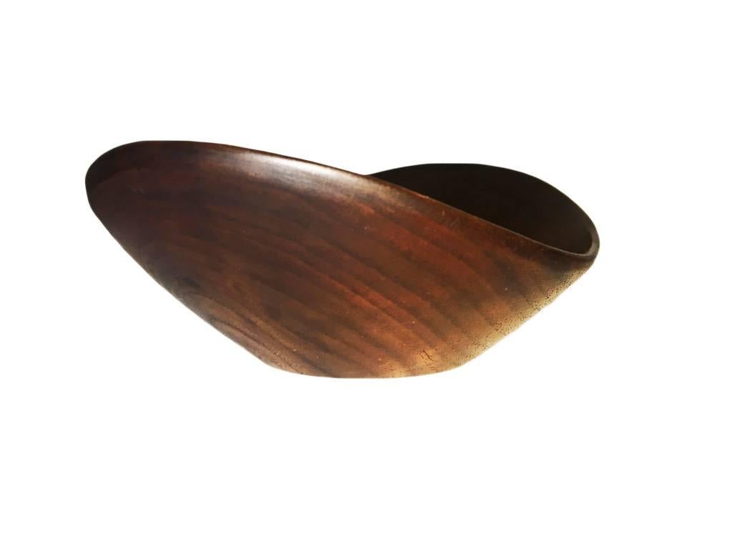Beautiful turned walnut bowl by Pennsylvania wood craftsman Paul Eshelman. 

Eshelman's wood creations won several awards and were exhibited widely. In 1958, his work was exhibited along with four other wood artists (Wharton Esherick, Bob