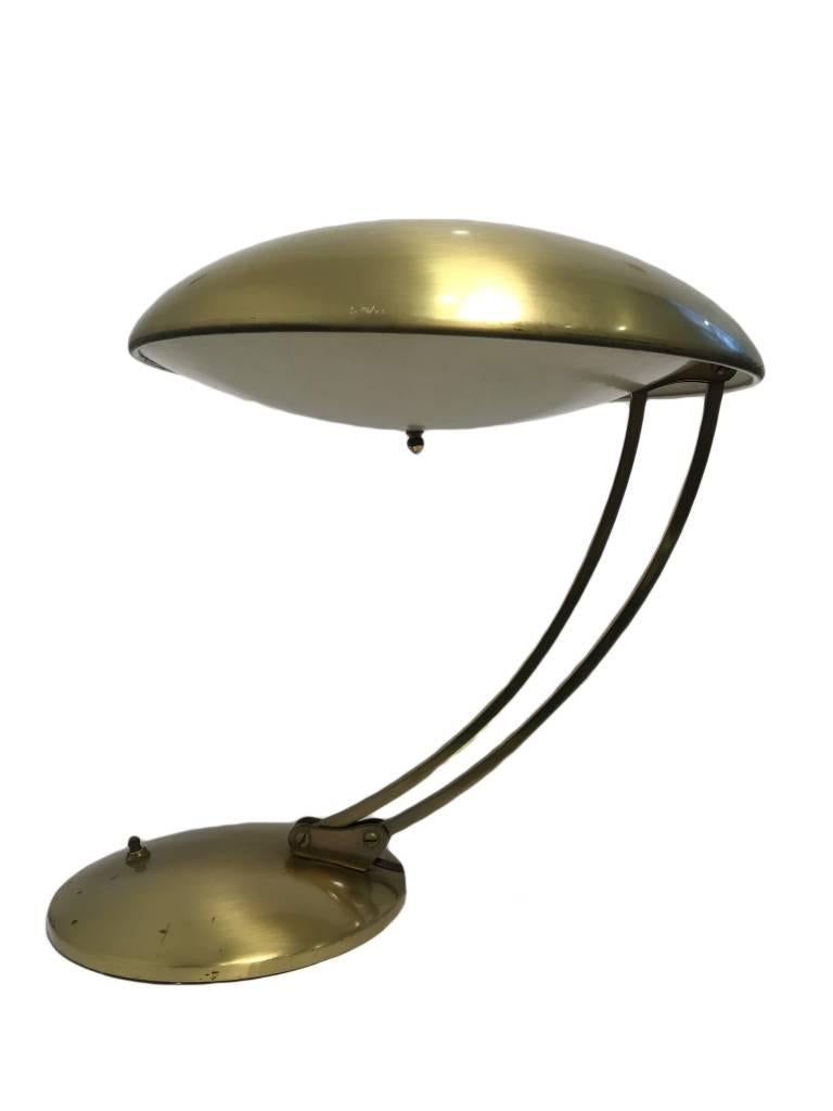 Stunning adjustable brass table lamp by the German designer and silversmith Christian Dell.