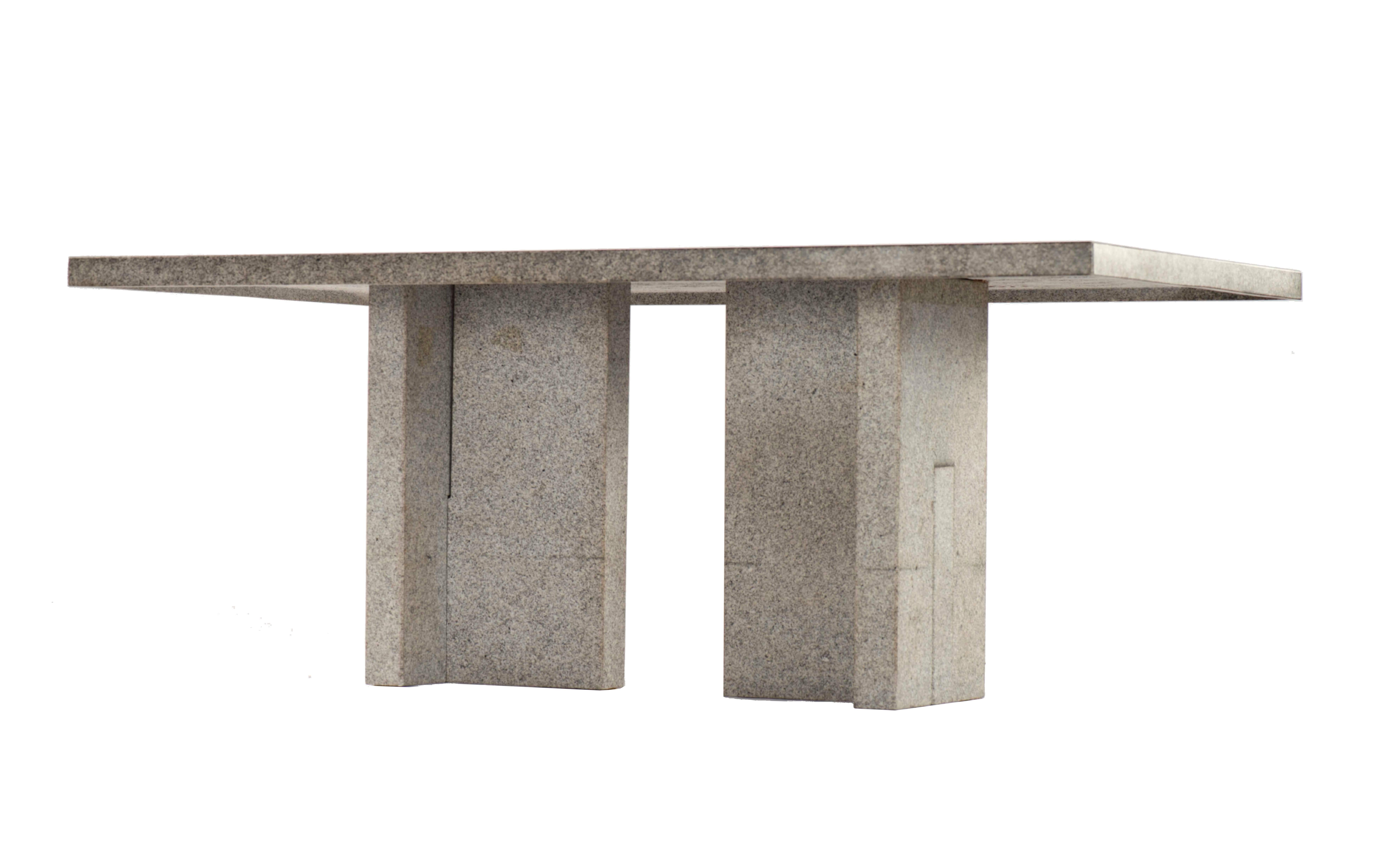 A rare granite dining table designed specifically for a 1960's Marcel Breuer & Associates residential project. Granite tables were a feature included in some residential and commercial structures designed by Marcel Breuer during his career. Two