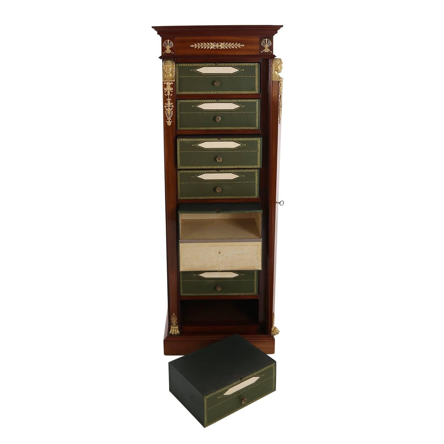 Rare 19th century Empire cartonnier with mahogany veneer and six pull-out boxes, covered in green with gold ornaments. Framed by gilt fittings in Egyptian style with sphinxes. Hidden in the lid several hidden compartments with unusual mechanics.
   