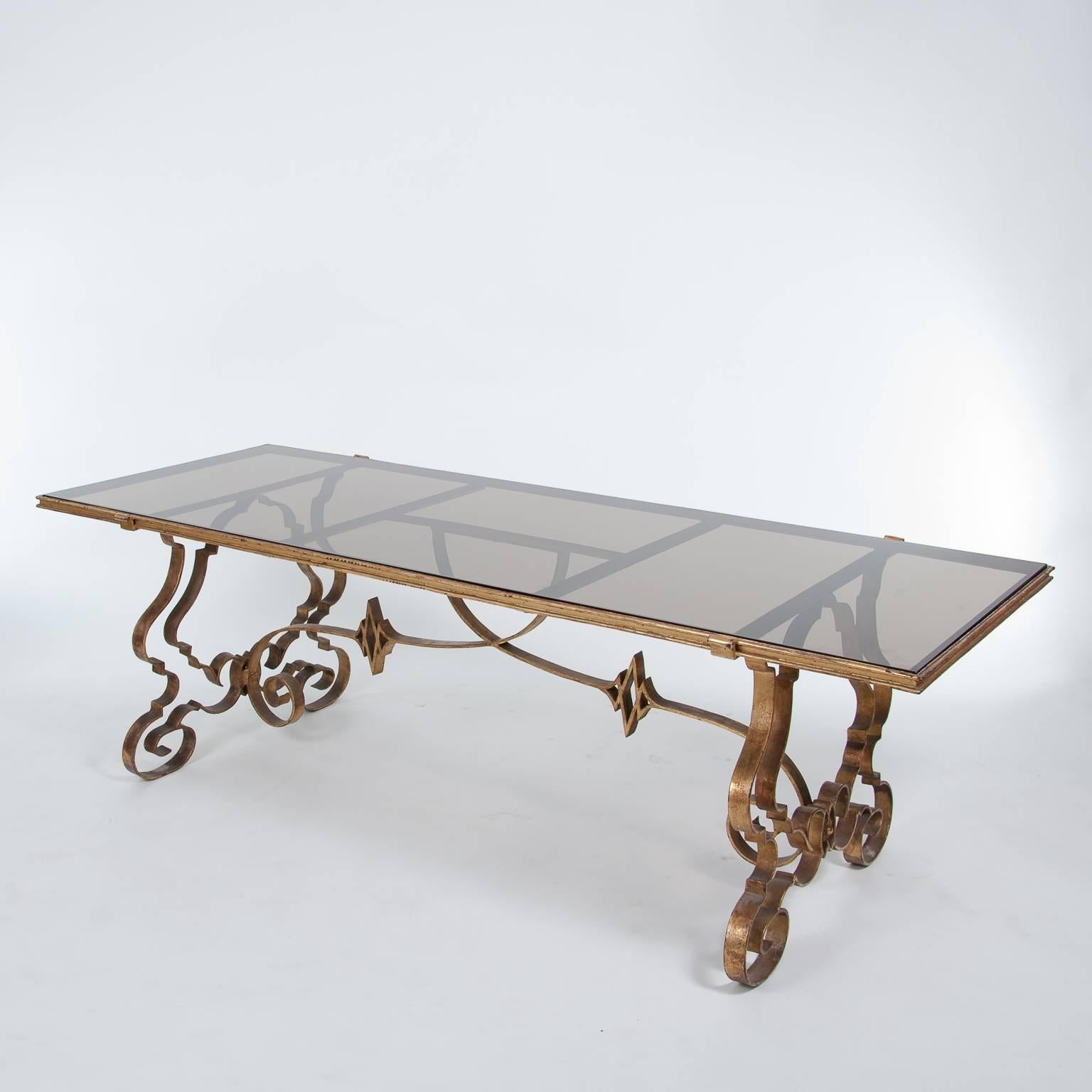 This elegant neoclassical French coffee table is made of a elegant shaped solid brass base. The glass top is in an excellent condition.