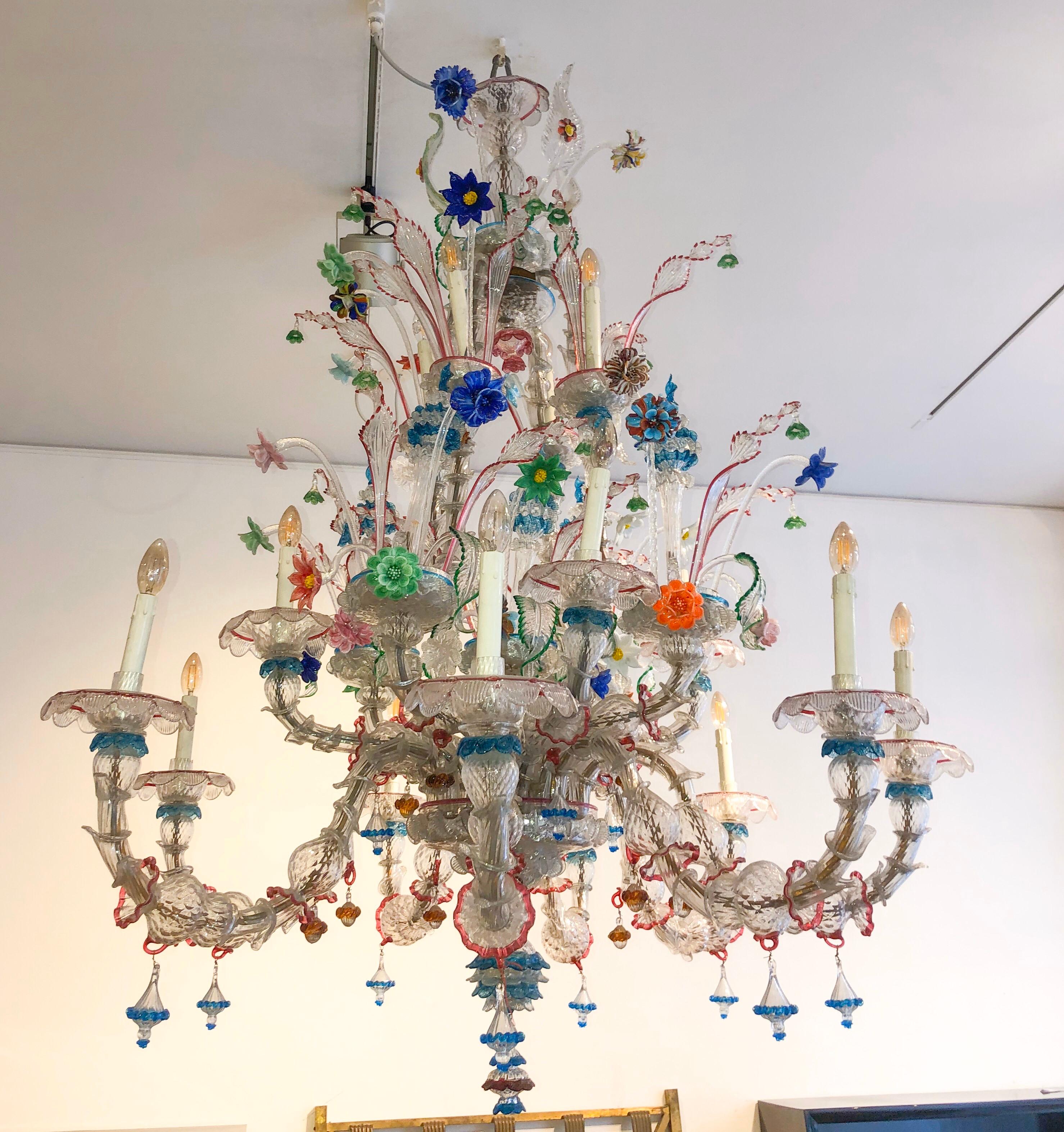 Magnificent colorful Ca'Rezzonico Murano glass chandelier from Italy from the 1940s. The type of Murano Chandelier is attributed to the famous glassmaker Galliano Ferro.

The colorful Murano chandelier has a total of 16 lights spread over four