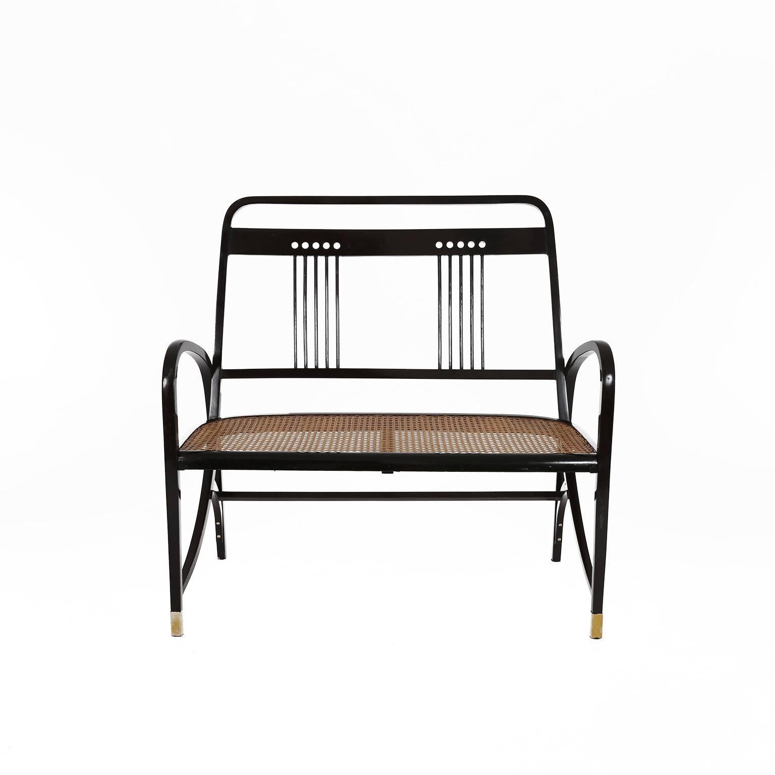 Rare Thonet Bentwood Suite Nr. 511; manufactured in Vienna, 1904 and attributed to Marcel Kammerer. This extraordinary dining suite features a bench, two armchairs and two chairs in rectangular-section bent beechwood and cane-bottomed. Paper label