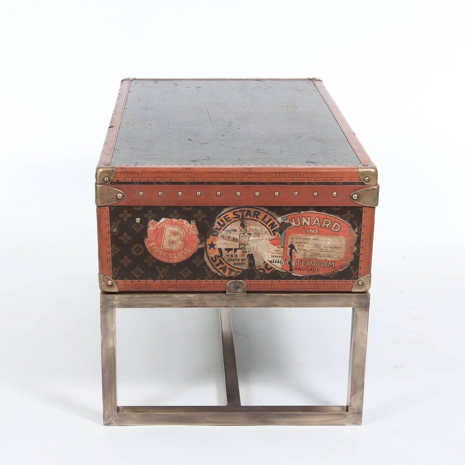 Antique French Louis Vuitton Alzer Suitcase On Modern Stand, France, Circa Antique French Louis Vuitton Alzer Suitcase On Modern Stand, France, Circa