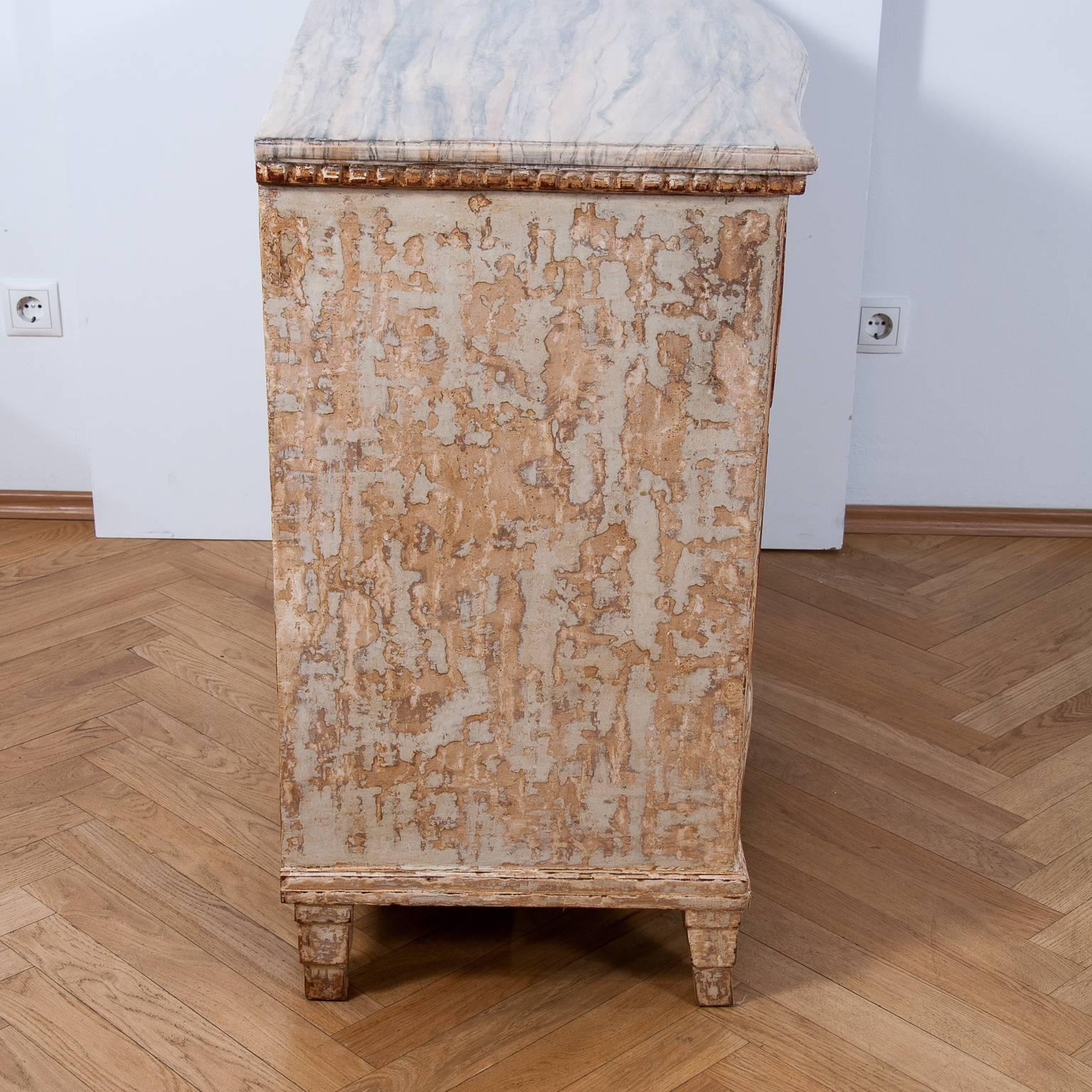 An exceptional, 18th century German Louis XVI chest of drawers with beautifully carved serpentine front and sides with new painted red, white and golden design, the commode has three drawers and has been fully restored and a finish in the Gustavian