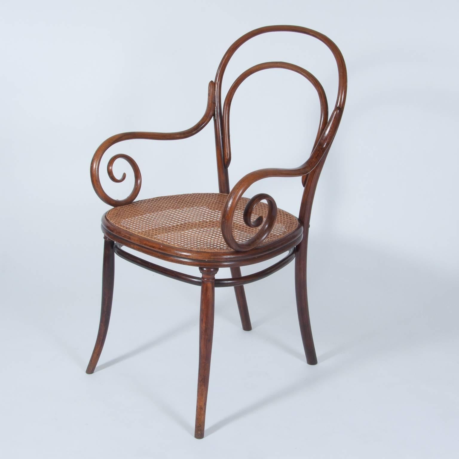 Antique Thonet bentwood armchair fauteuil no. 2, designed 1868, manufactured 1885.
An extraordinary piece of furniture; armchair, show piece, side chair or even dining chair.

One of very the hard to find Thonet model no. 11.
Armrest fixed w/