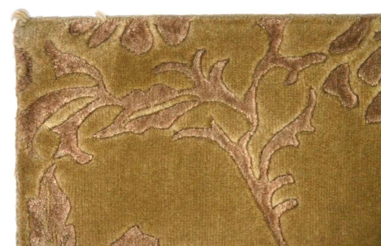 A warm and graceful rug, perfect for the bedroom or layered over carpet to create an intimate seating area within a larger space. The wool/silk blend makes for a luxurious texture that invites touch provides cushion under foot. 

Deep golden base