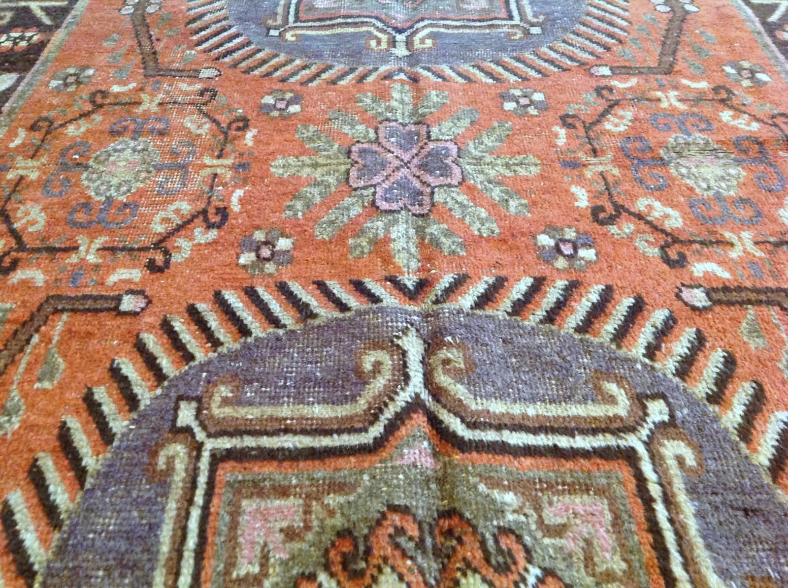 Vintage Khotan rug 
Measures: 4'11
