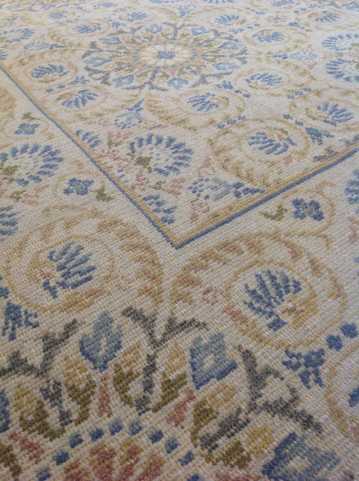 Geometric Floral European rug
Colors: Tan, cream, dark brown, grey, blue.