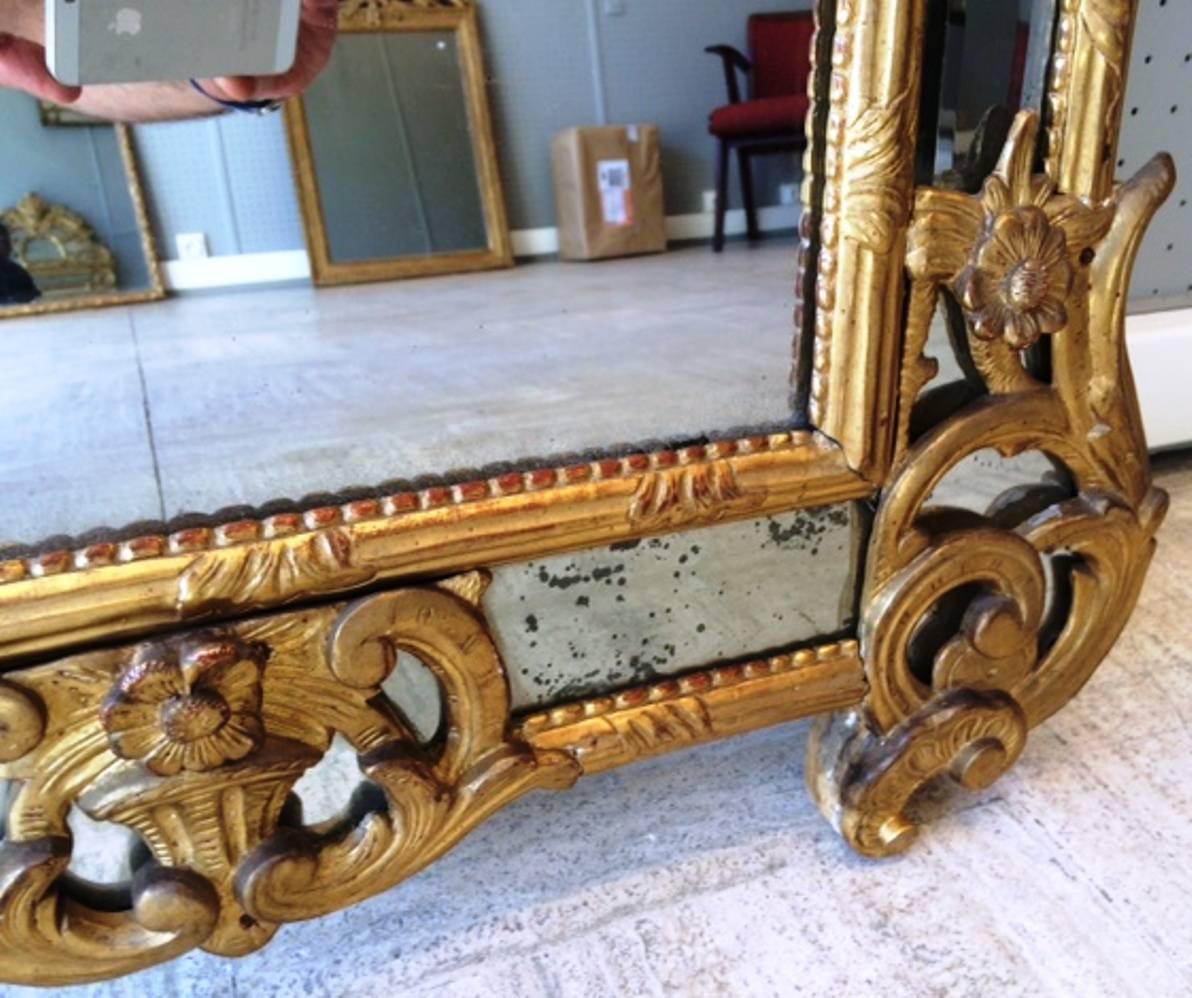 Early 18th Century Spectacular French Regence Period Carved Giltwood Mirror, France, circa 1730 For Sale