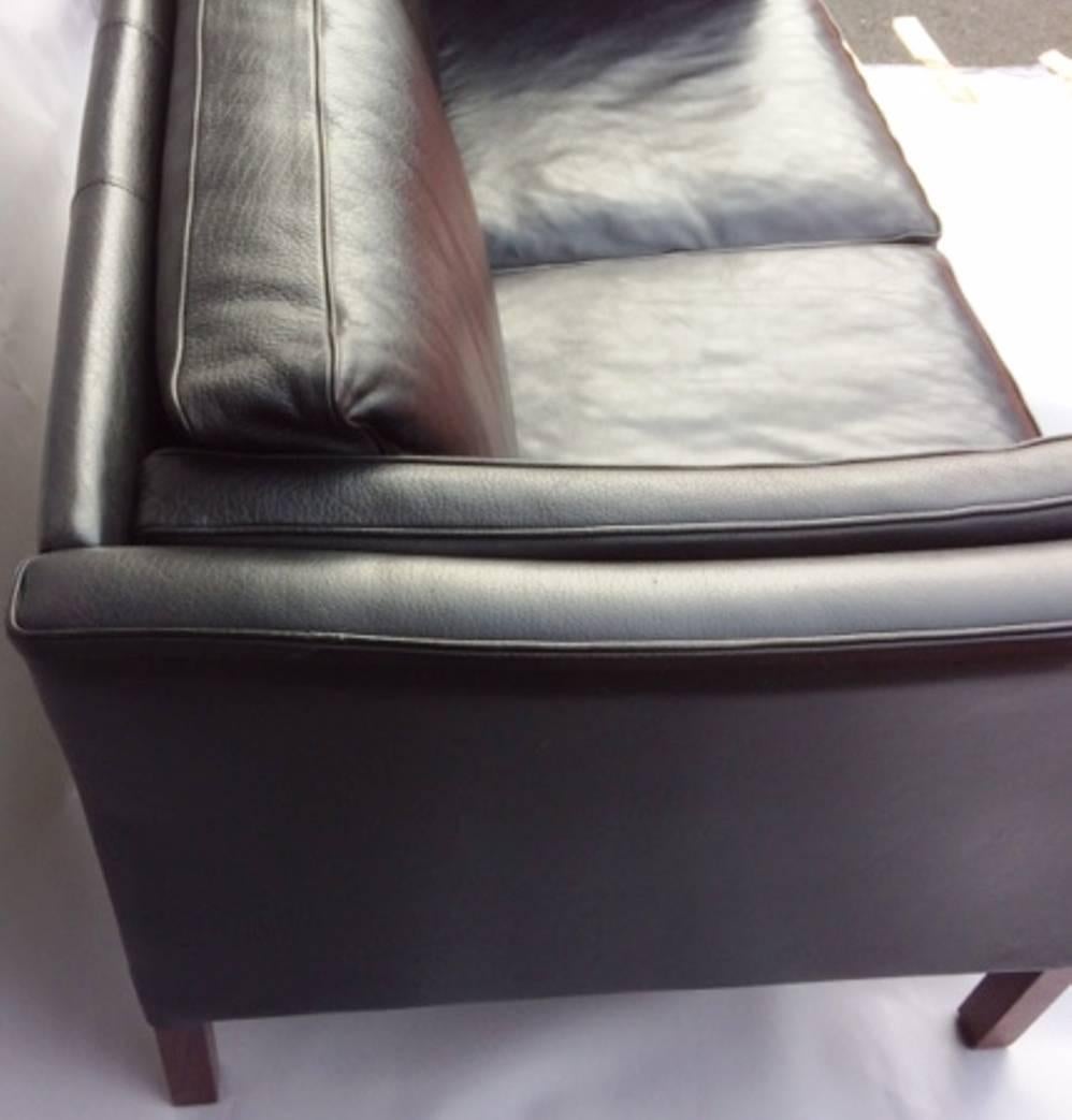 Beautiful two-seat sofa, Scandinavian, 1970s.
Black leather.