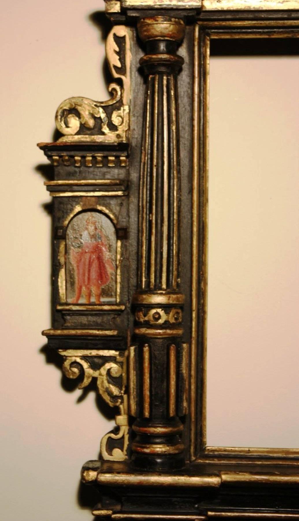 Very rare 17th century tabernacle frame mounted as mirror, Germany, dated 1633.
Carved polychrome and gilded wood.
A small painting on each side.
Dated on the bottom.
Probably pinewood.
As a frame, the sight size is 33 cm x 24 cm.
the overall