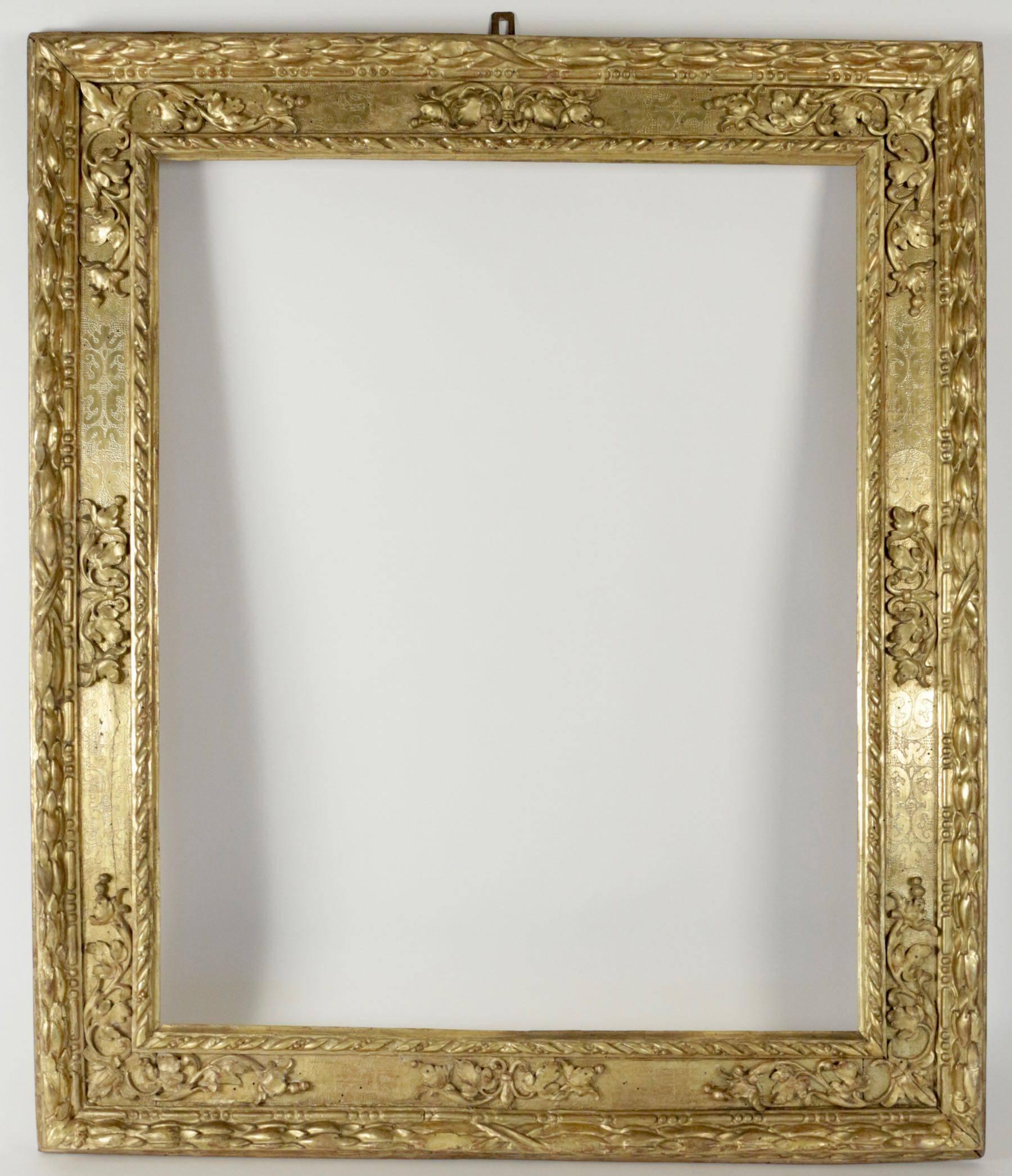 Beautiful Italian carved giltwood frame mounted as mirror, Northern Italy, 17th century. 
Sight size as frame is: 88 cm x 71cm
Overall size is: 114 cm x 97 cm.
Mirror plate is modern