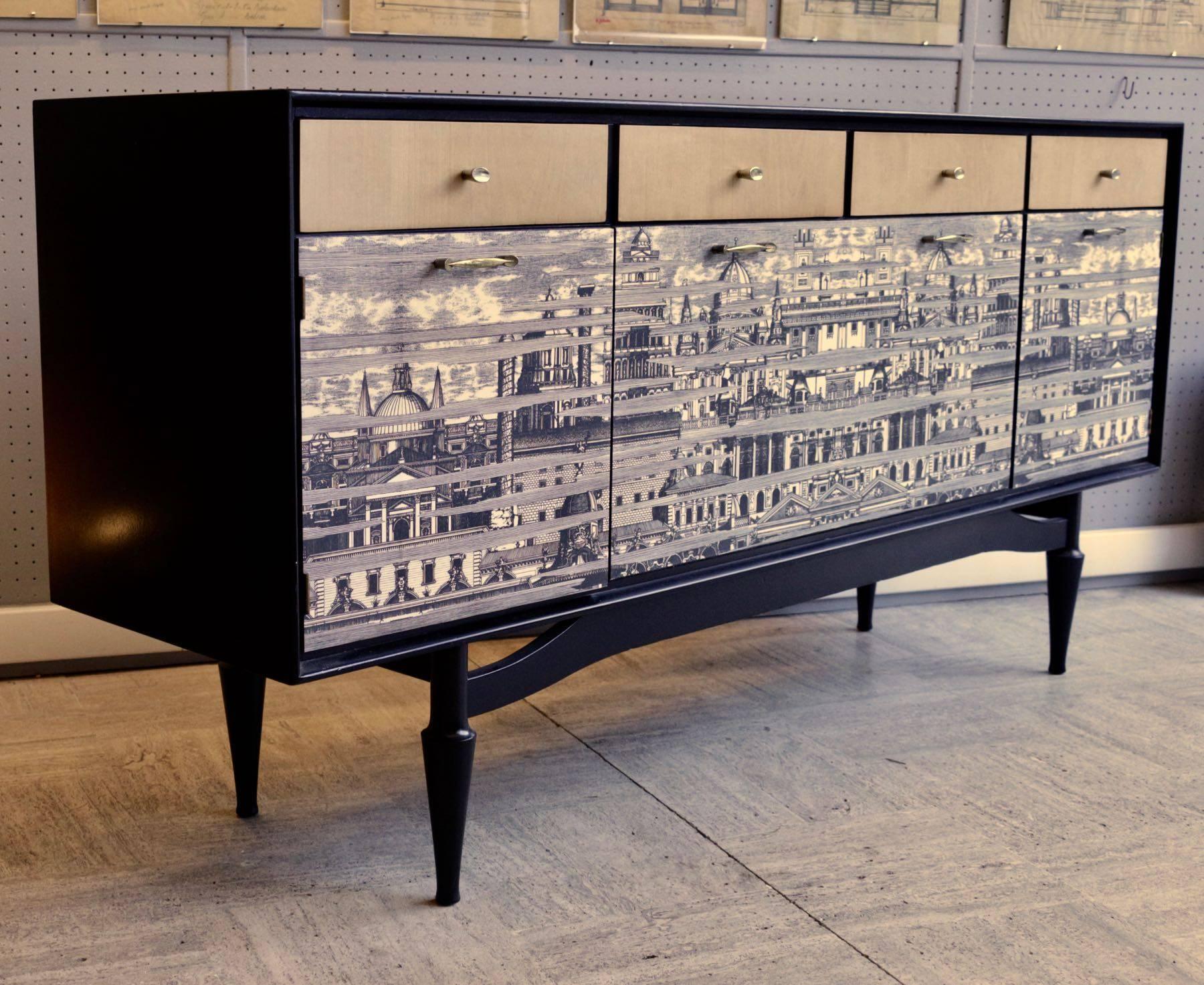 Spectacular revamped 1950s sideboard in the taste of Fornasetti.
Elegant sideboard from the 1950s, with Fornasetti style design applied on doors. (Customized recently).
Drawers are in fruitwood.
It is in the style of Fornasetti, not by