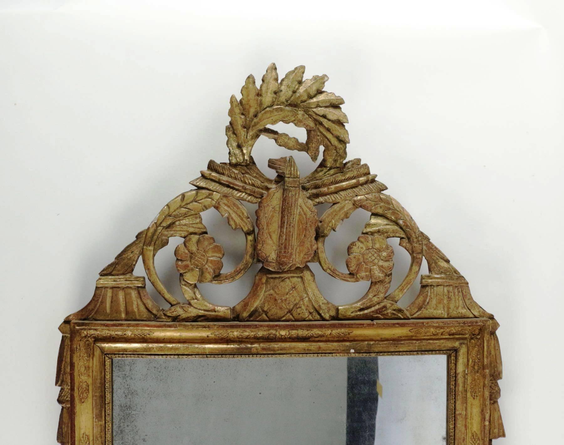 Beautiful late Louis XVI period carved giltwood mirror, France, late 18th century
with period mirror plate.