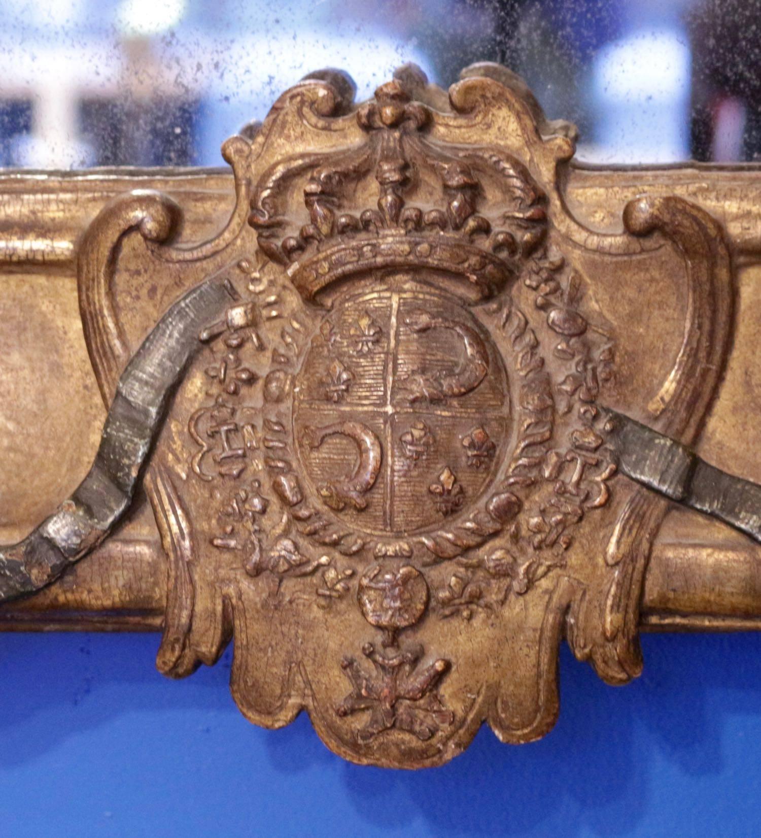 Exceptional French Royal frame mirror for the Grand Dauphin, circa 1670.
Carved giltwood.
The Grand Dauphin, born in 1661, was the eldest son of Louis XIV.
The frame presents stylized dolphins on each side, four different shells on each corner