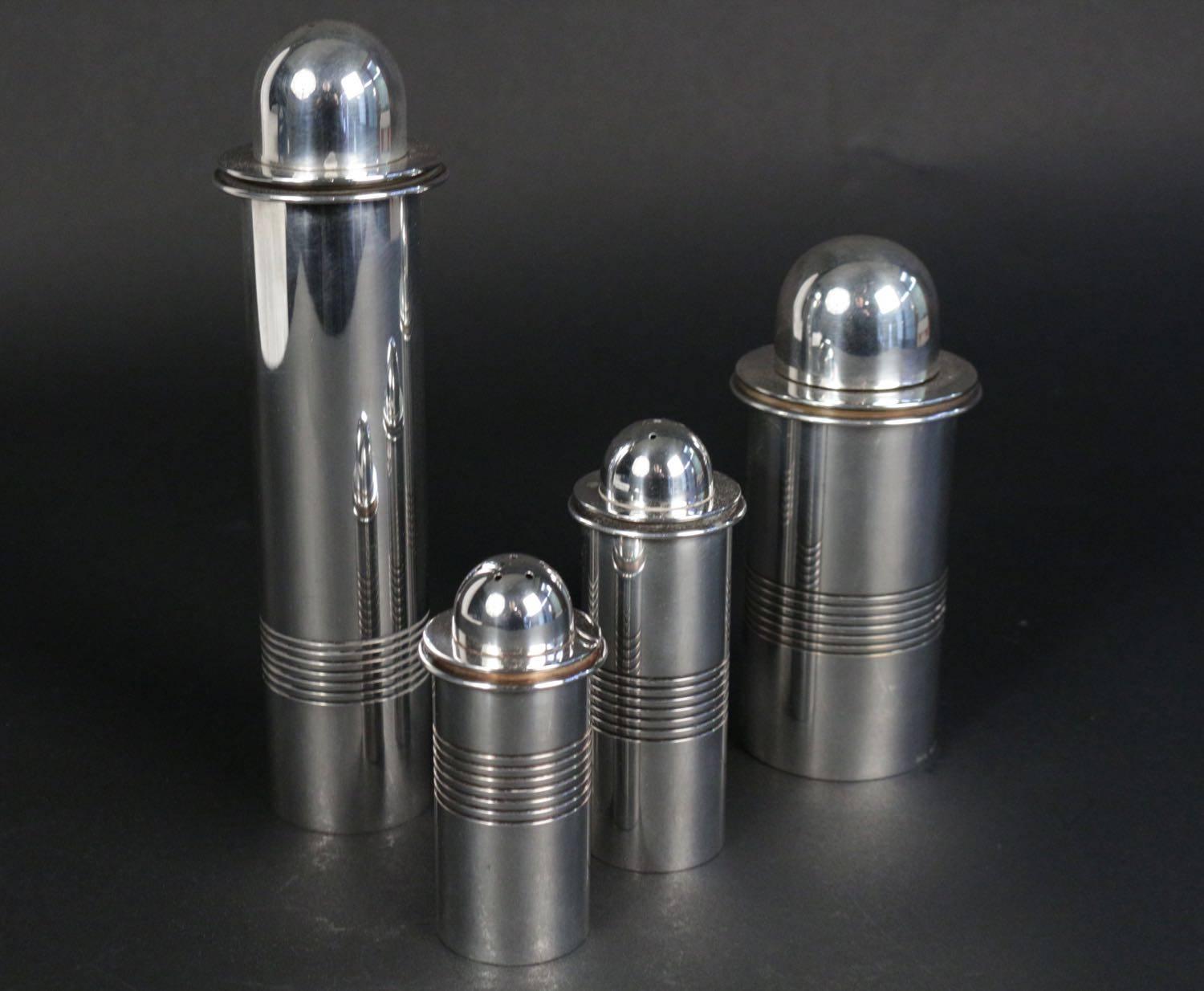 Rare Set of silver plated table ware by Lino Sabattini, 1960s.
It includes:
One pepper mill.
Height:23 cm Diam: 7 cm.
One pepper Shaker.
Height: 12 cm Diam : 5 cm.
One salt Shaker.
Height: 10 cm Diam : 5 cm.
One Paremsan grater (including