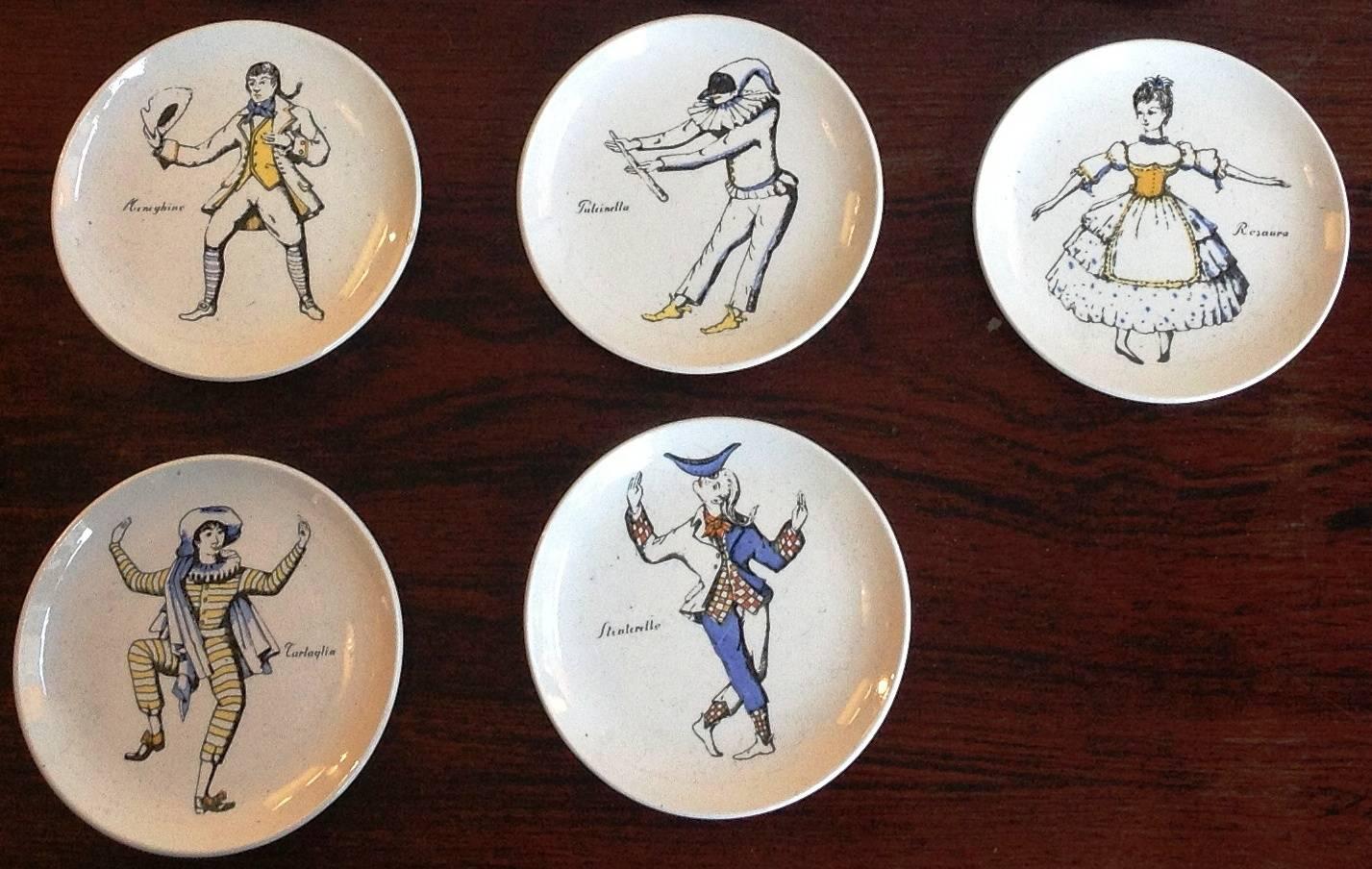 Piero Fornasetti: Rare and complete set of eight 'Maschere Italiane' coasters, 1950s-1960s in original cardboard box with maker's label and dividers.
Hand-painted porcelain.
Diameter: 4" (cm 10.3 each).
Period: circa 1955.
Marked: