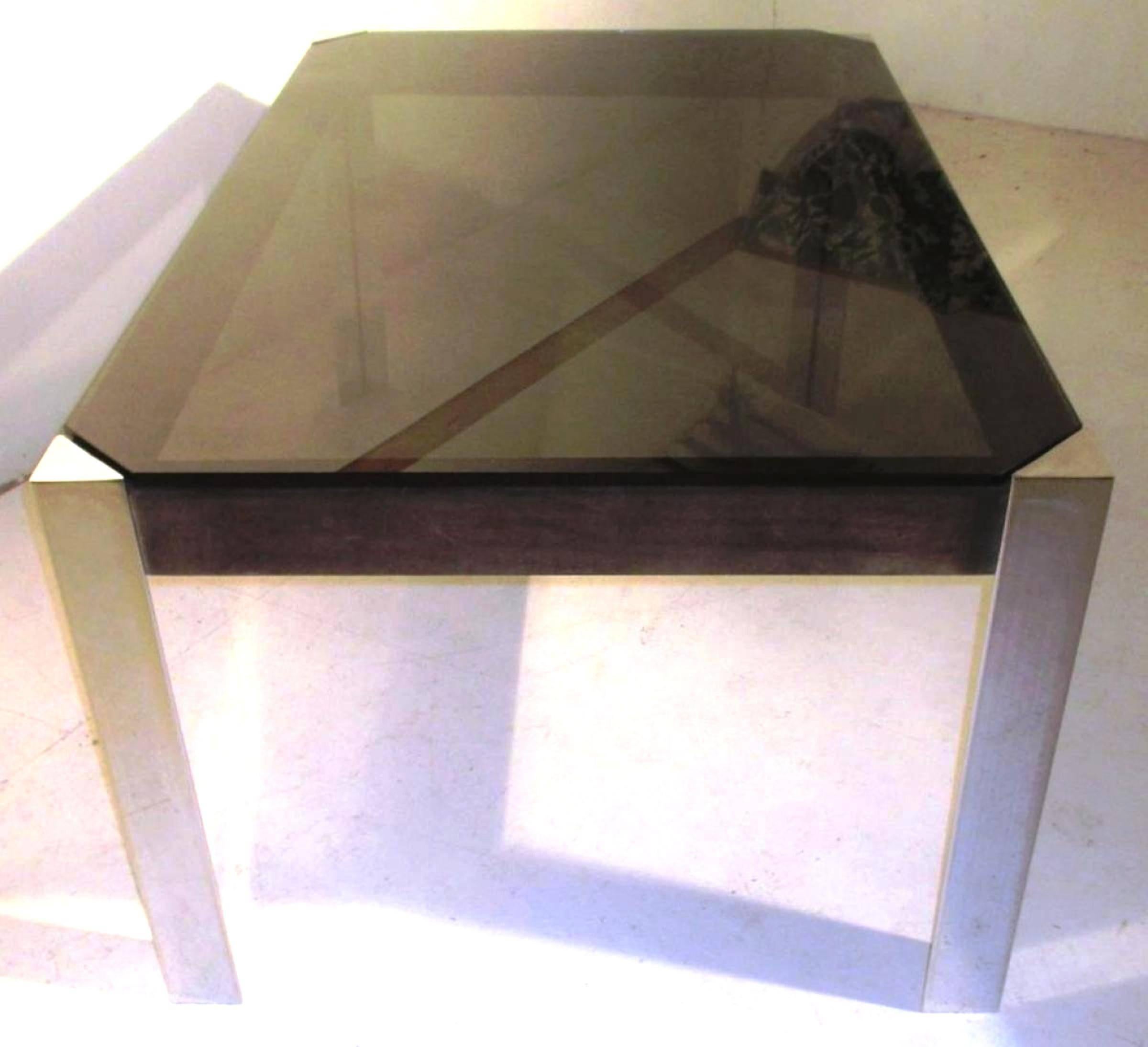 Spectacular and Rare Guido Faleschini table, desk for Hermes, France, 1970s
The triangular legs are chrome metal
The side is in nubuck / suede
smoked glass top.
Hermes commissioned some presentation furniture to Guido Faleschini in the 1970s, as