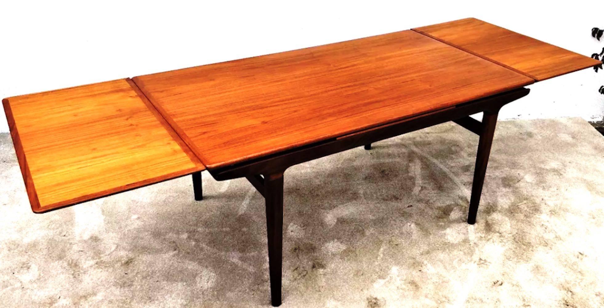 Beautiful Scandinavian teak dining tale by Johannes Andersen for Mobelfabrik, late 1950s.
With built-in extensions, Denmark.
Dimensions without extensions:
W 160 cm, D 90 cm, H 73 cm

With extensions
Width 260 cm.