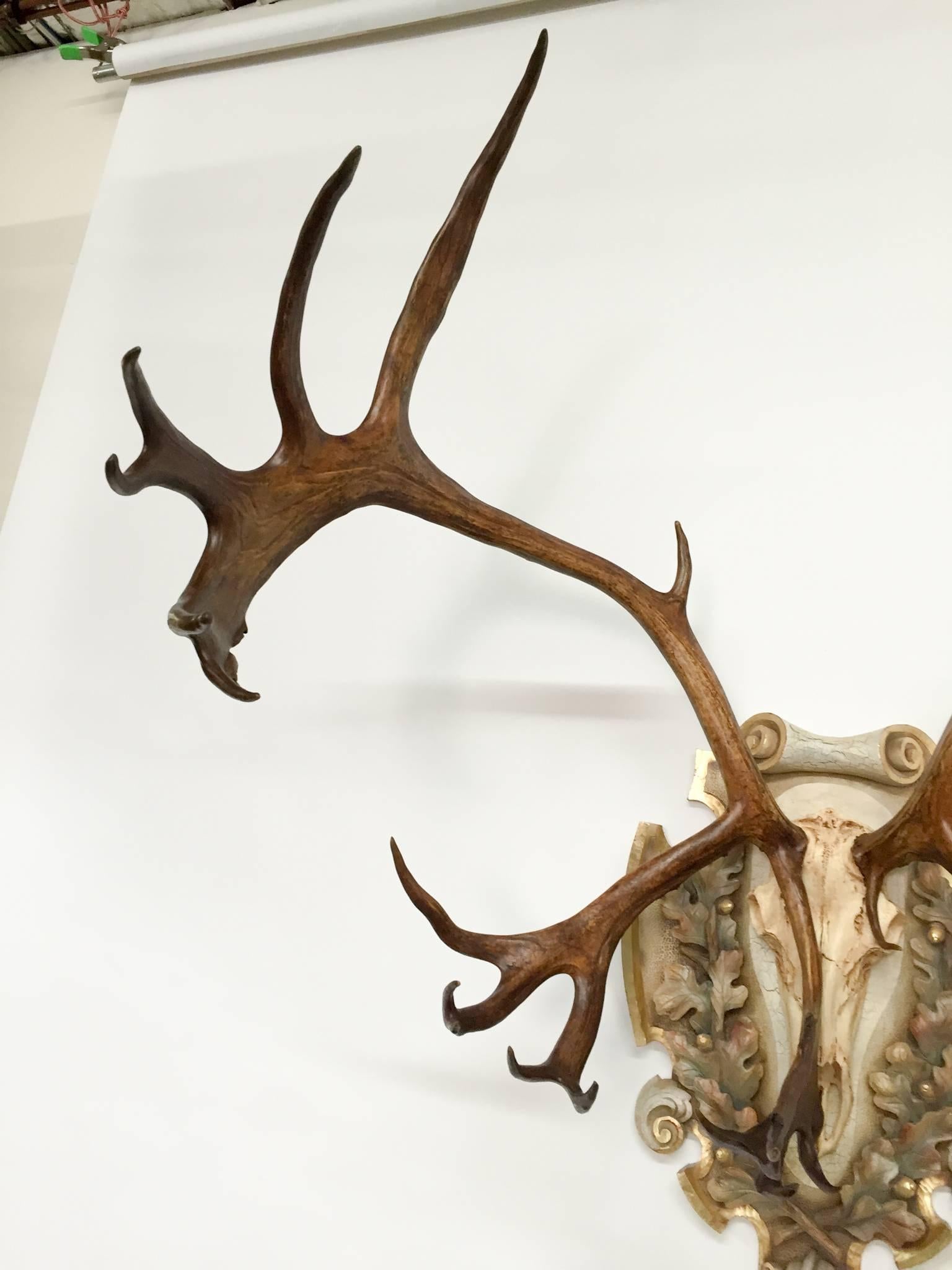 Vintage Alaskan Caribou on hand-carved linden wood and Italian painted polychrome plaque. A most impressive and magnificent piece in person.  Noted for the impressively large 