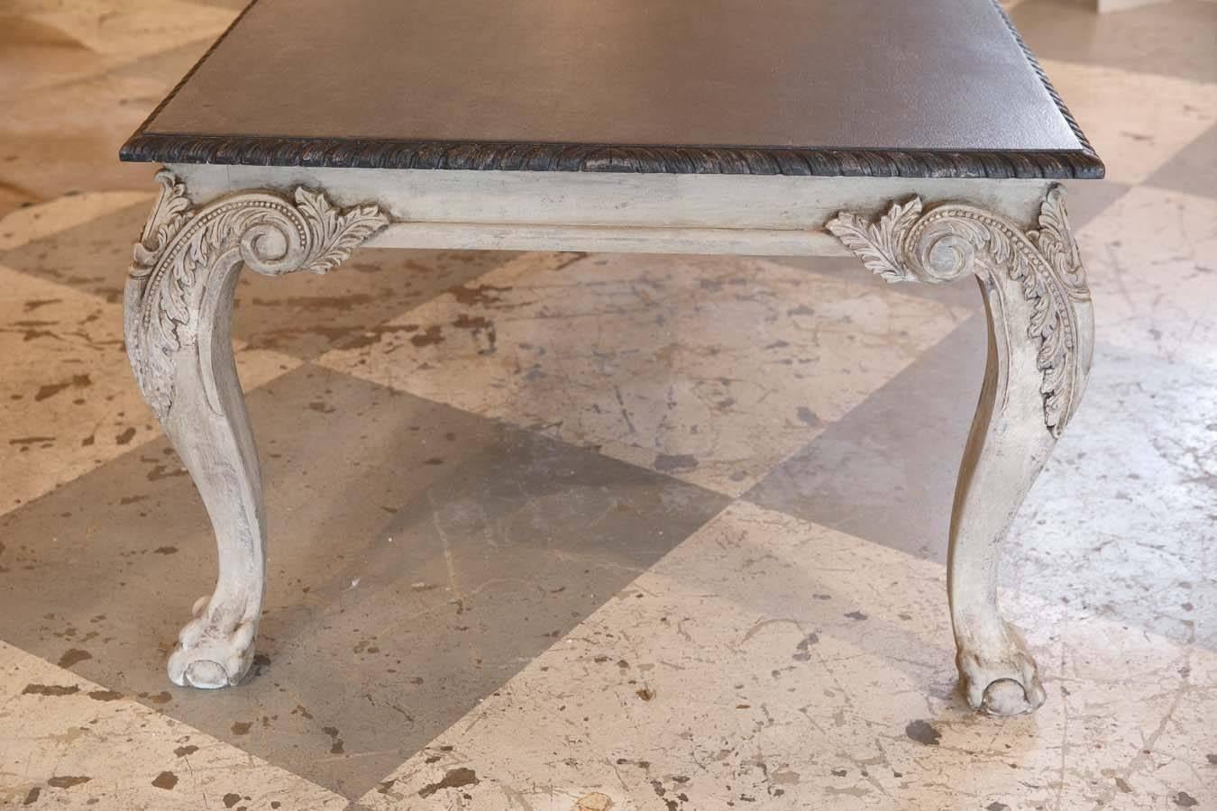 A certain statement piece for your dining area or as a desk, this hand-carved table from Egypt is in the Chippendale design with ball and claw feet and features a beautiful faux marble painted top and grey distressed painted legs. 

Measures