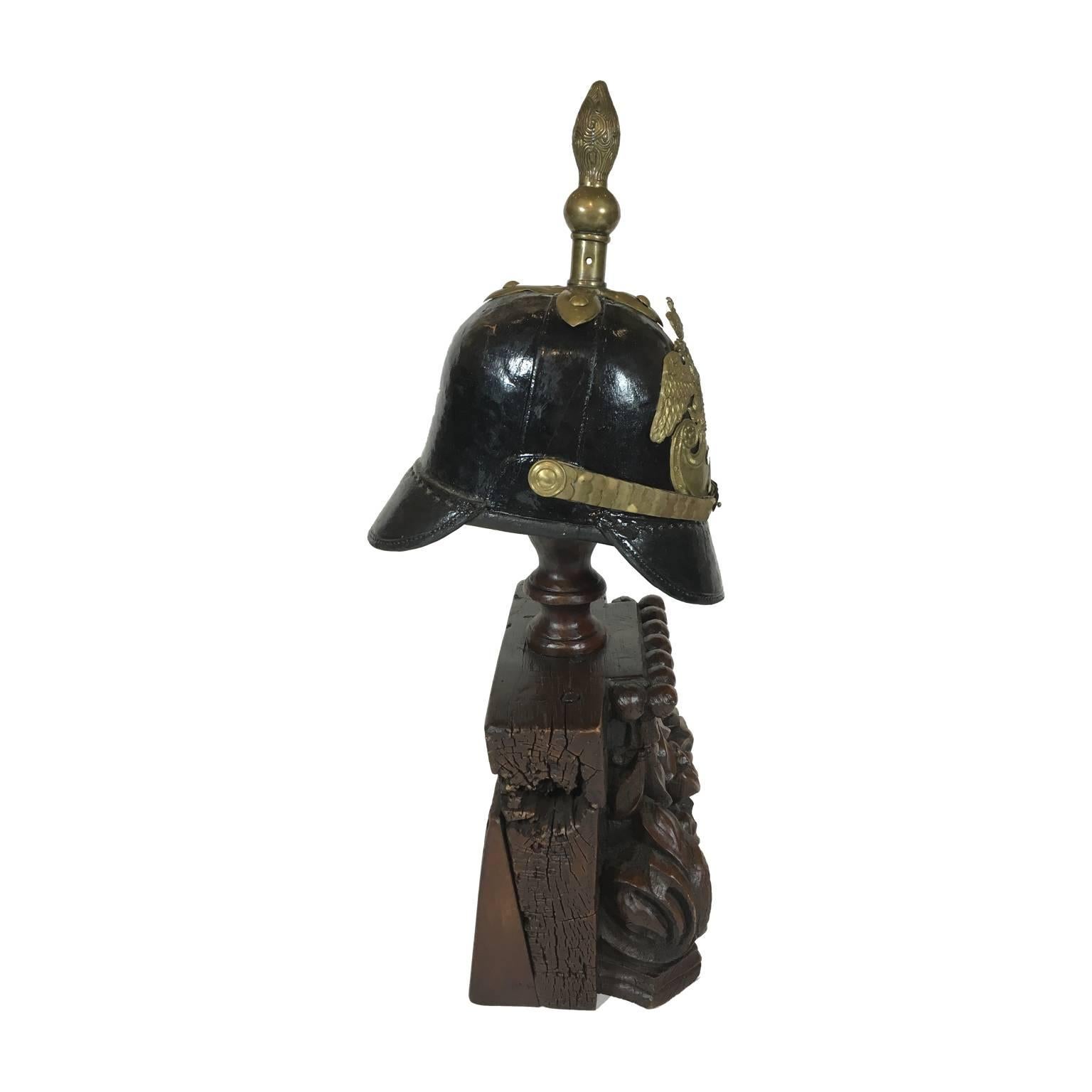 This is a 19th century Imperial Russian Officer's Pickelhaube (Spiked Helmet) on an antique Bulgarian stand. The base is a vintage hand-carved Bulgarian column capital. Part of an extensive collection of pickelhaube officer's helmets from Imperial