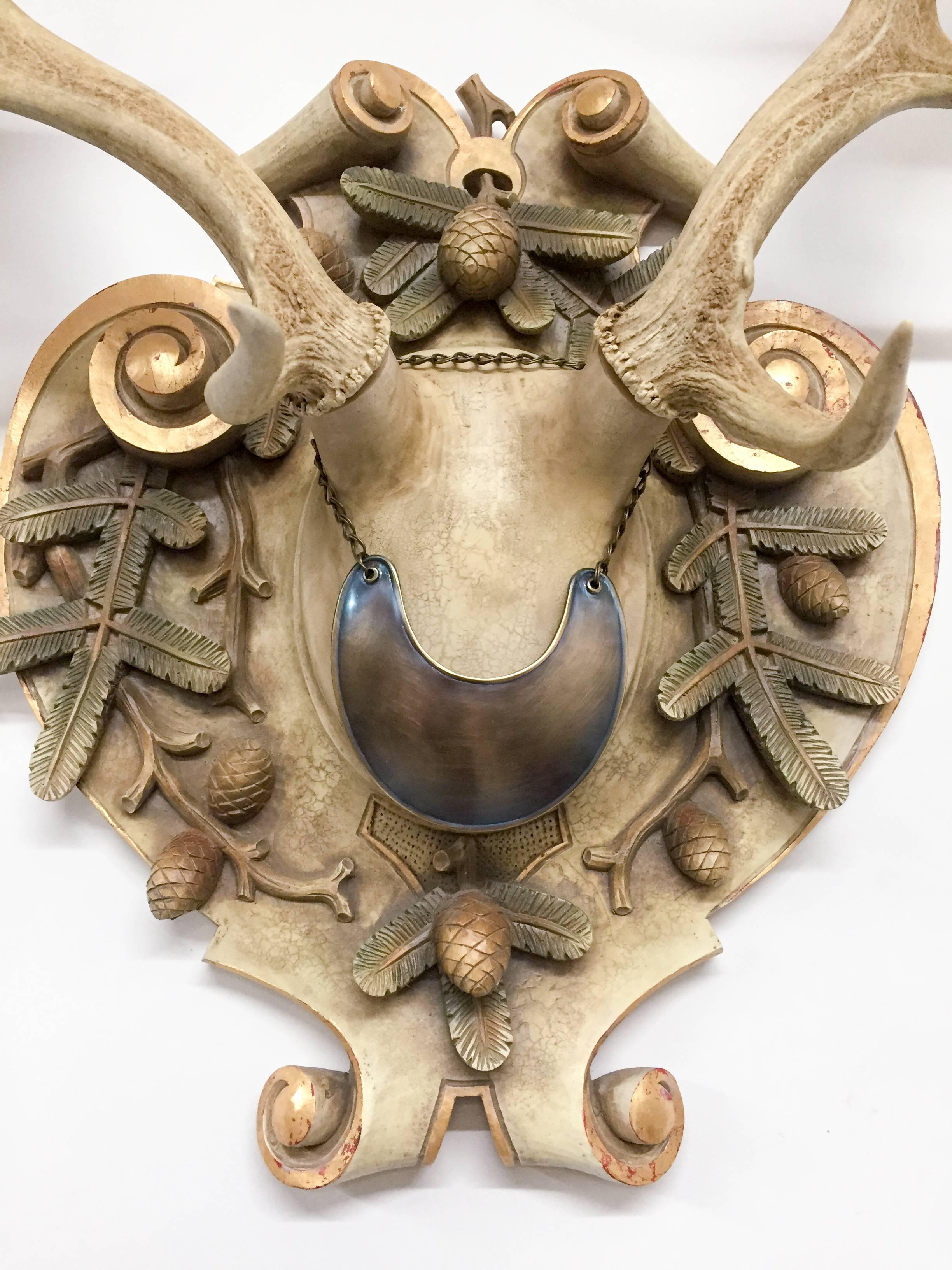 19th century fallow deer trophy from Emperor Franz Josef's castle at Eckartsau in the Southern Austrian Alps, a favorite hunting schloss of the Habsburg Royal family. This historic hunting trophy features an original French gorget displayed on a