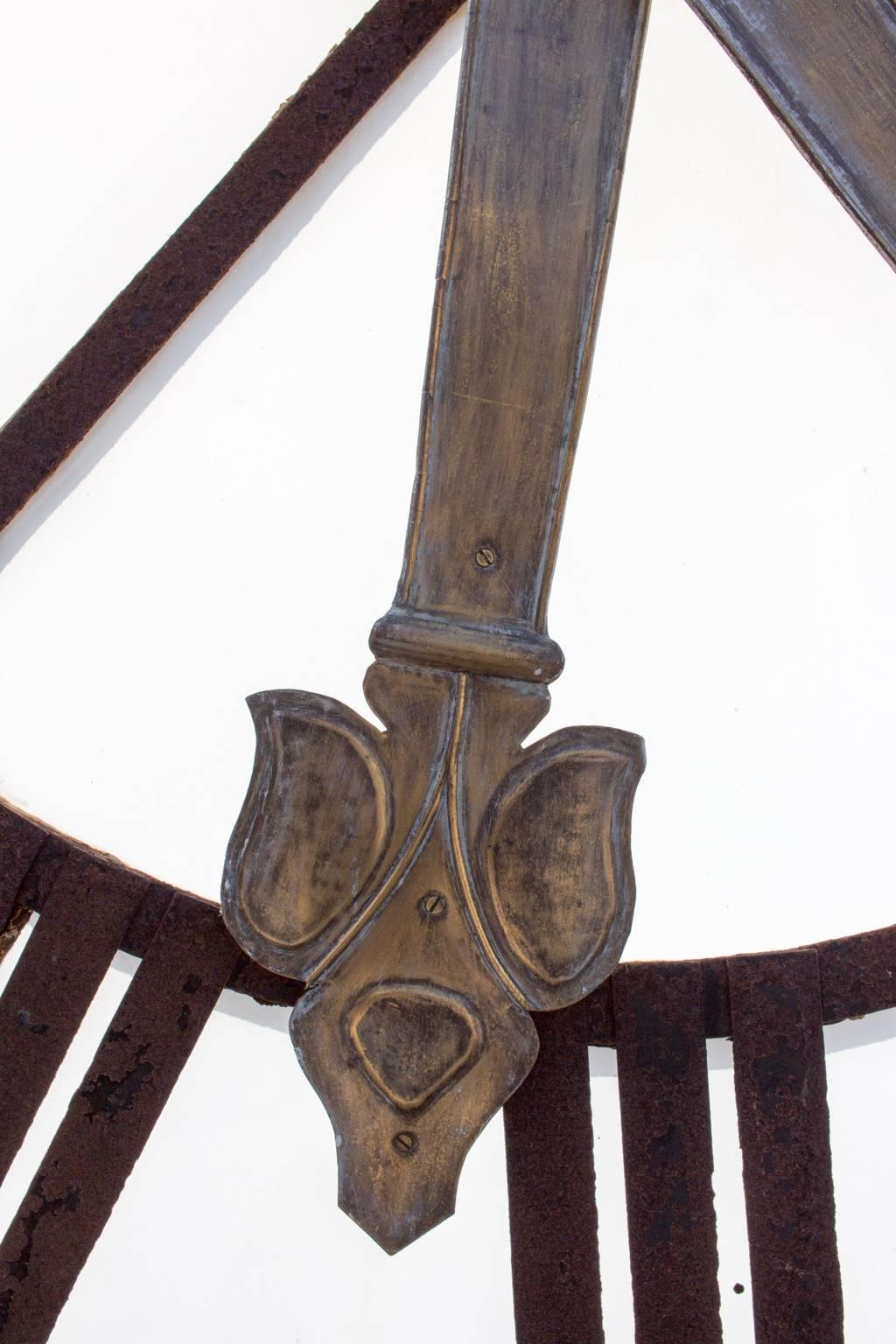 This stunning clock-face was removed from a French church tower and is crafted of iron and glass. The opaque white glass face provides beautiful contrast with the distressed iron face and hands. Discovered in France, this 19th century piece is sure