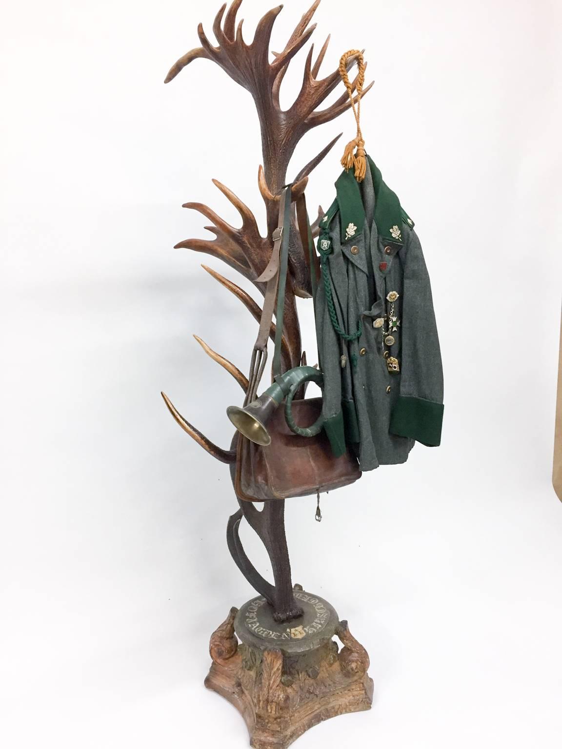 Truly a unique piece of history, this antique Red Stag antler hall tree and coat rack originated from Emperor Franz Joseph's castle at Eckartsau, a favorite hunting schloss of the Habsburg family in the Southern Austrian Alps. Hanging from the hall