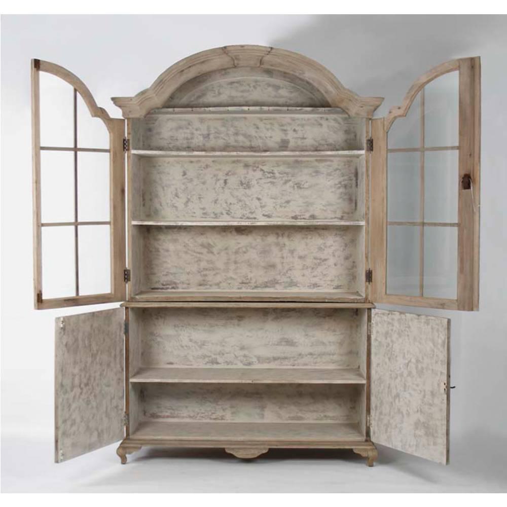With a French curved top down to the dramatic foundation, the large distressed Hugh Cabinet is a bold yet graceful piece. Soft wood tones, a gracefully curved top, and the look of weathered oak and elmwood render this cabinet as beautiful as it is