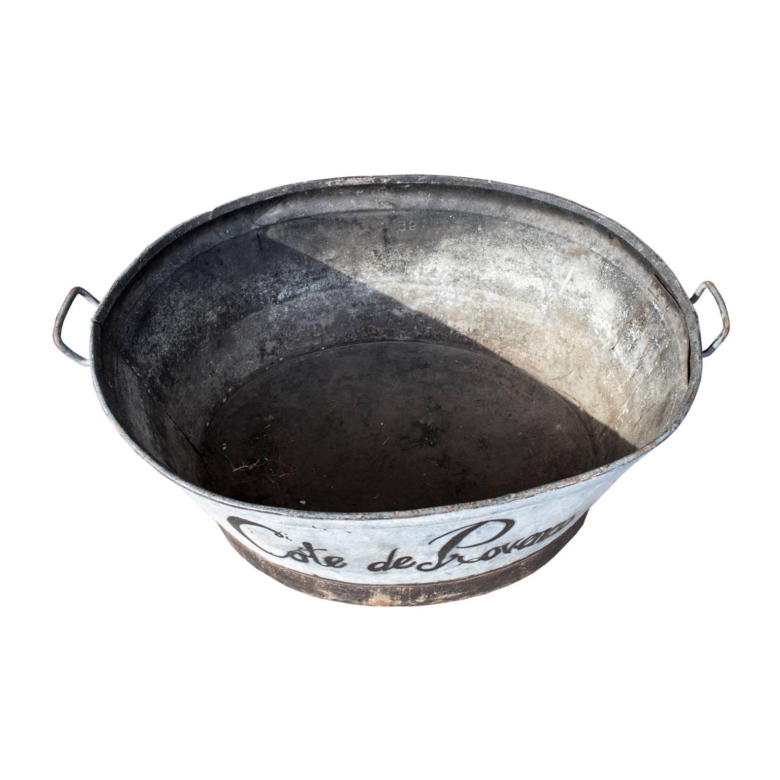 This oversized beauty of a zinc tub was discovered during our recent time in France and it's large-scale nature makes it excellent for corralling toys, blankets, firewood...or ice and vast amounts of wine for your next soiree.

Measures: 41