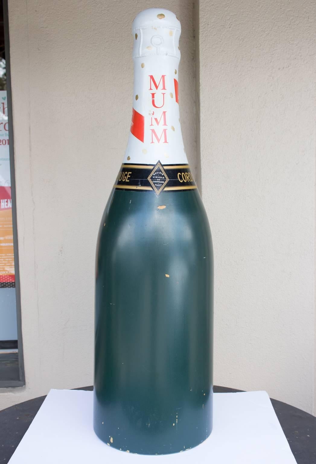 champagne bottle with red stripe