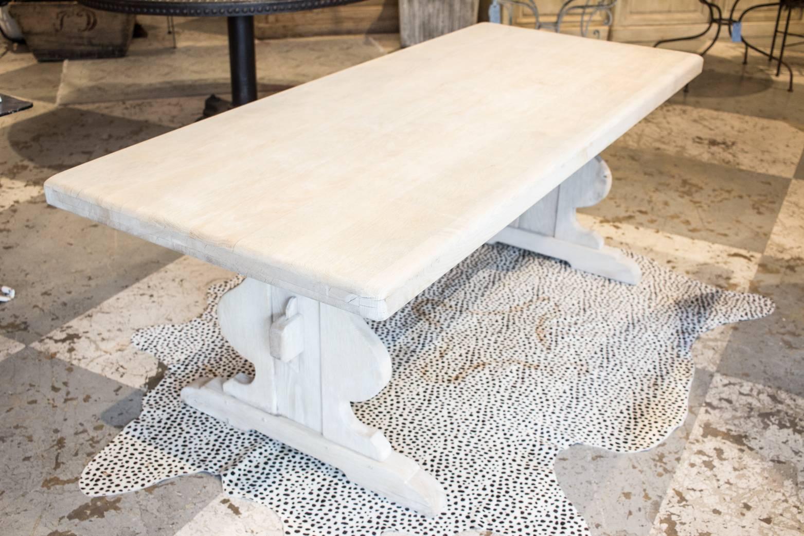 This wonderful farmhouse oak table was discovered in Belgium. This table could easily seat up to eight, and would also work well with bench seating. Top is one solid piece and features a beautifully rounded edge. Measures 79