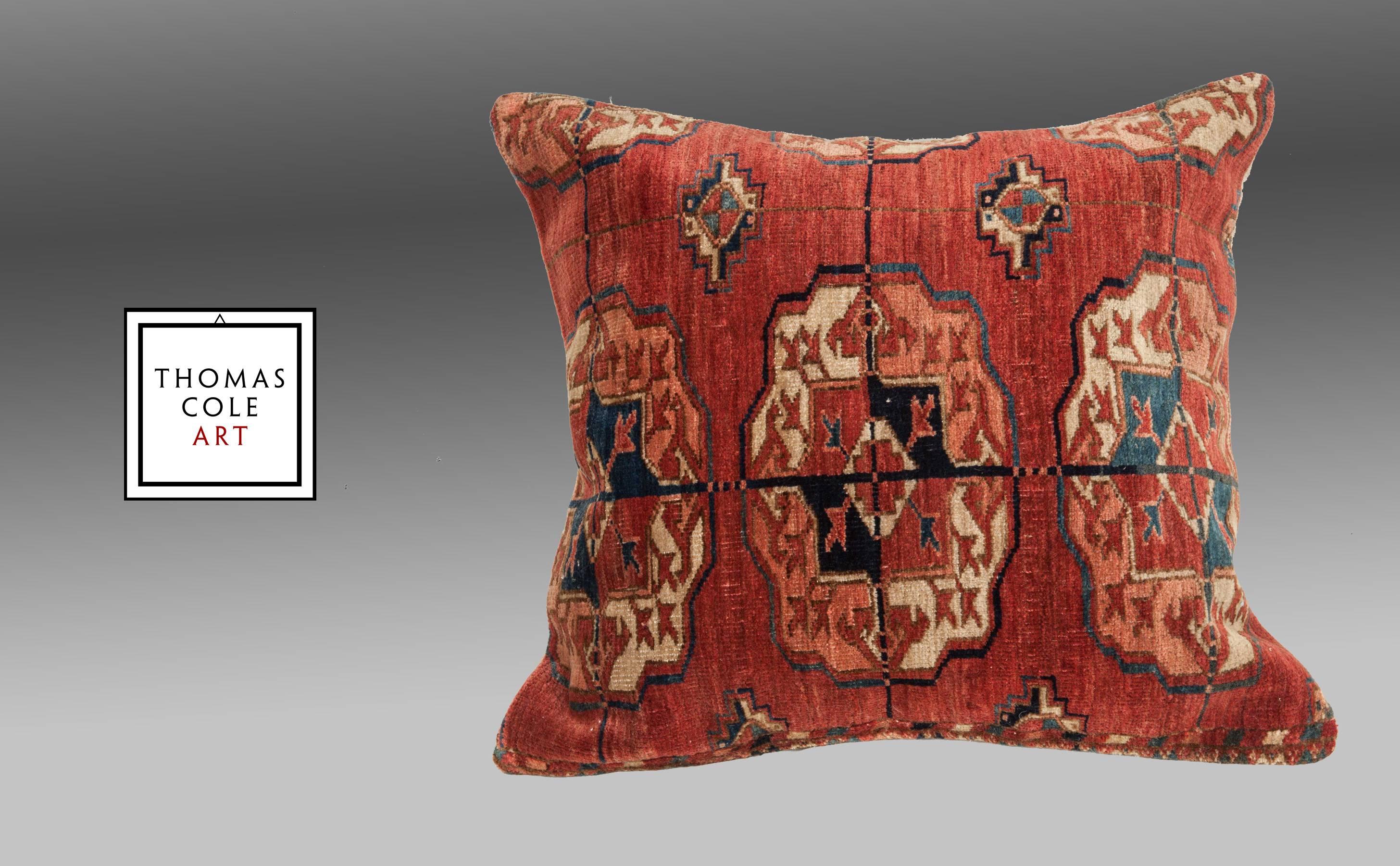 A pillow fashioned from an antique Tekke Turkmen tribal rug. 

Measures 20