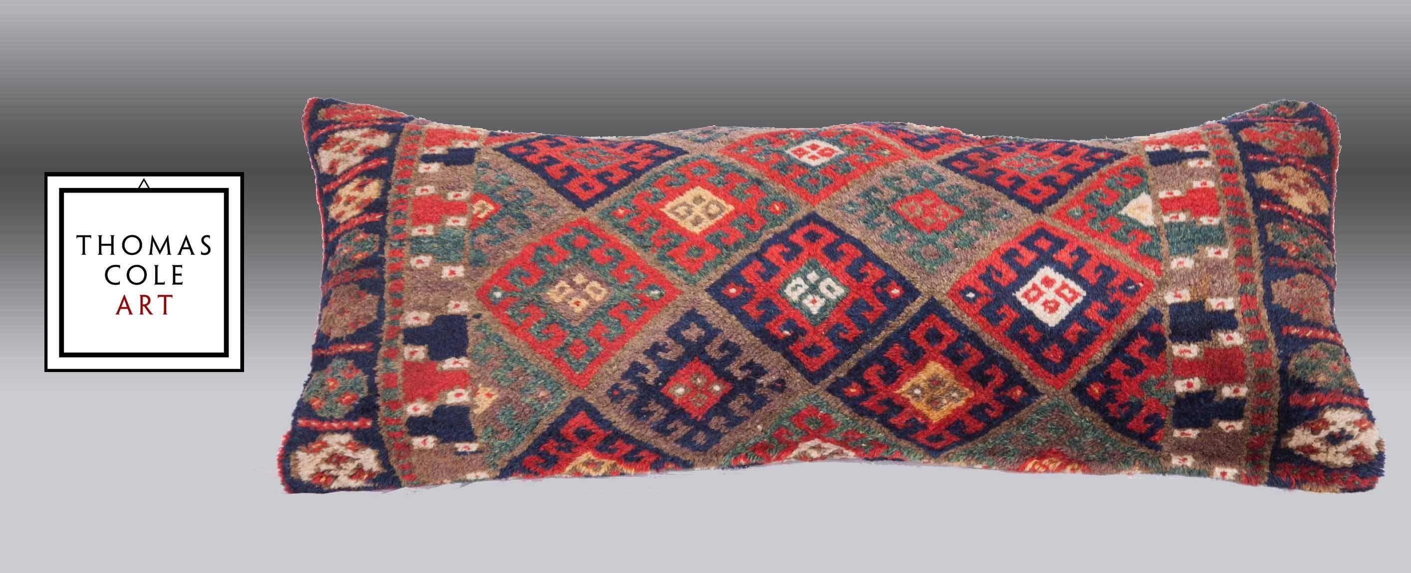 A fabulously colorful wool pile pillow composed of a rug from the Jaf Kurd people of west Persia dating to the 19th century. All the dyes are derived from natural dyes and the condition is good.

It comes with an insert to accommodate filling.